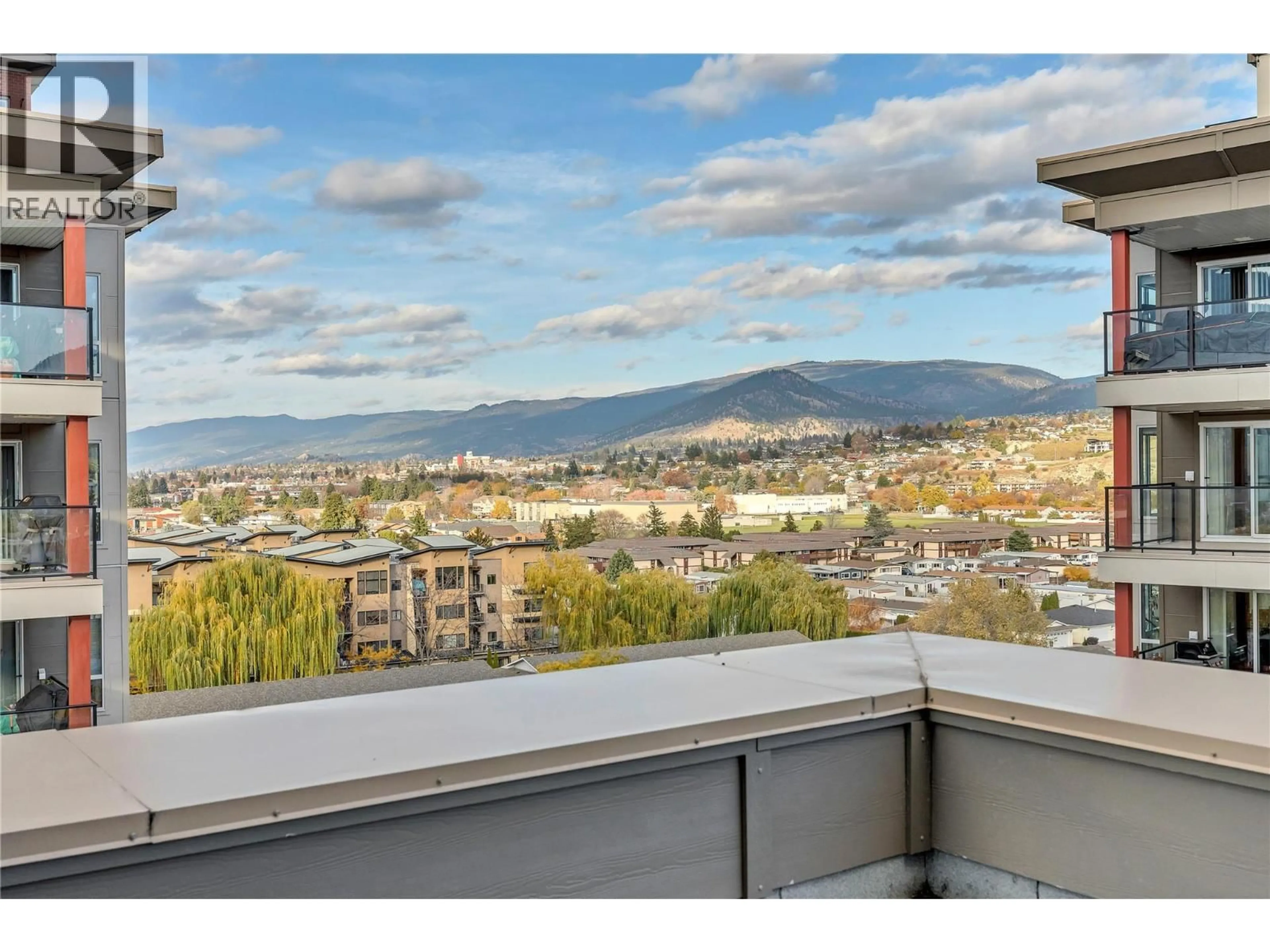 Balcony in the apartment, city buildings view from balcony for 901 - 3388 SKAHA LAKE ROAD, Penticton British Columbia V2A6G4