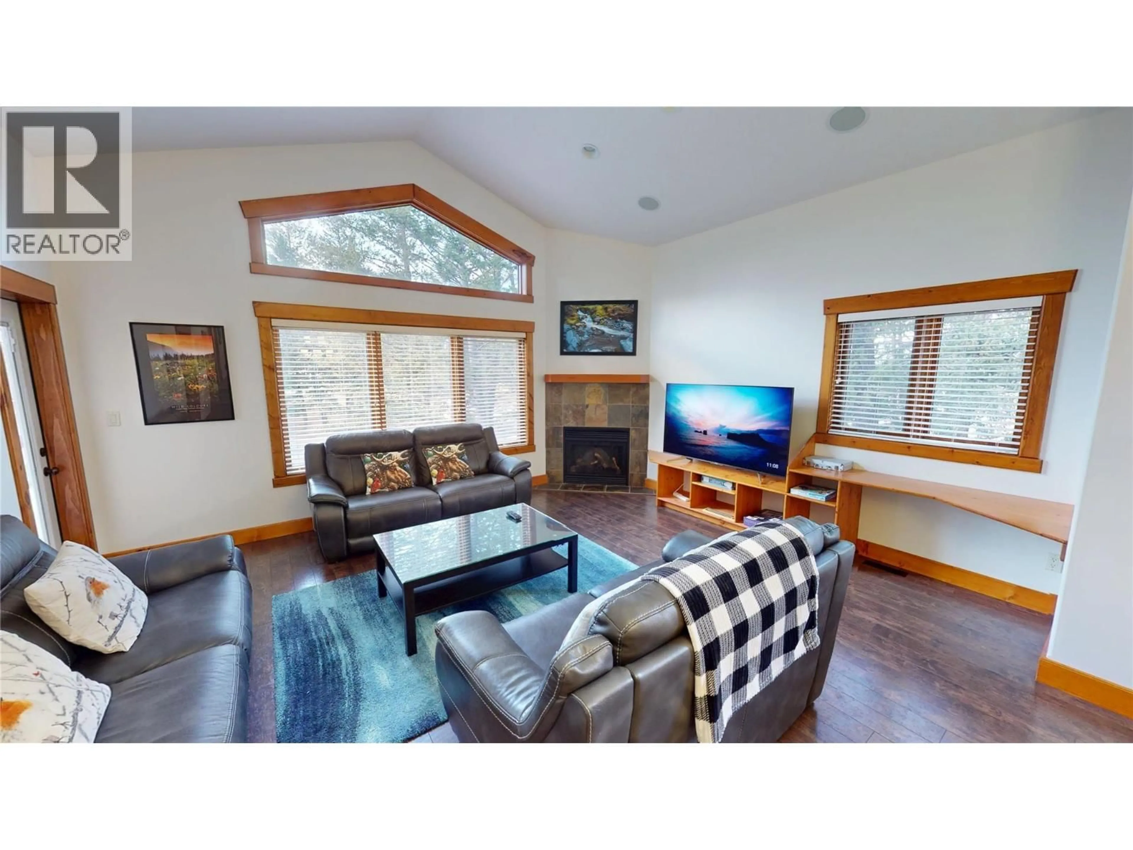 Living room with furniture, wood/laminate floor for 7305 COPPERHORN DRIVE, Radium Hot Springs British Columbia V0A1M0