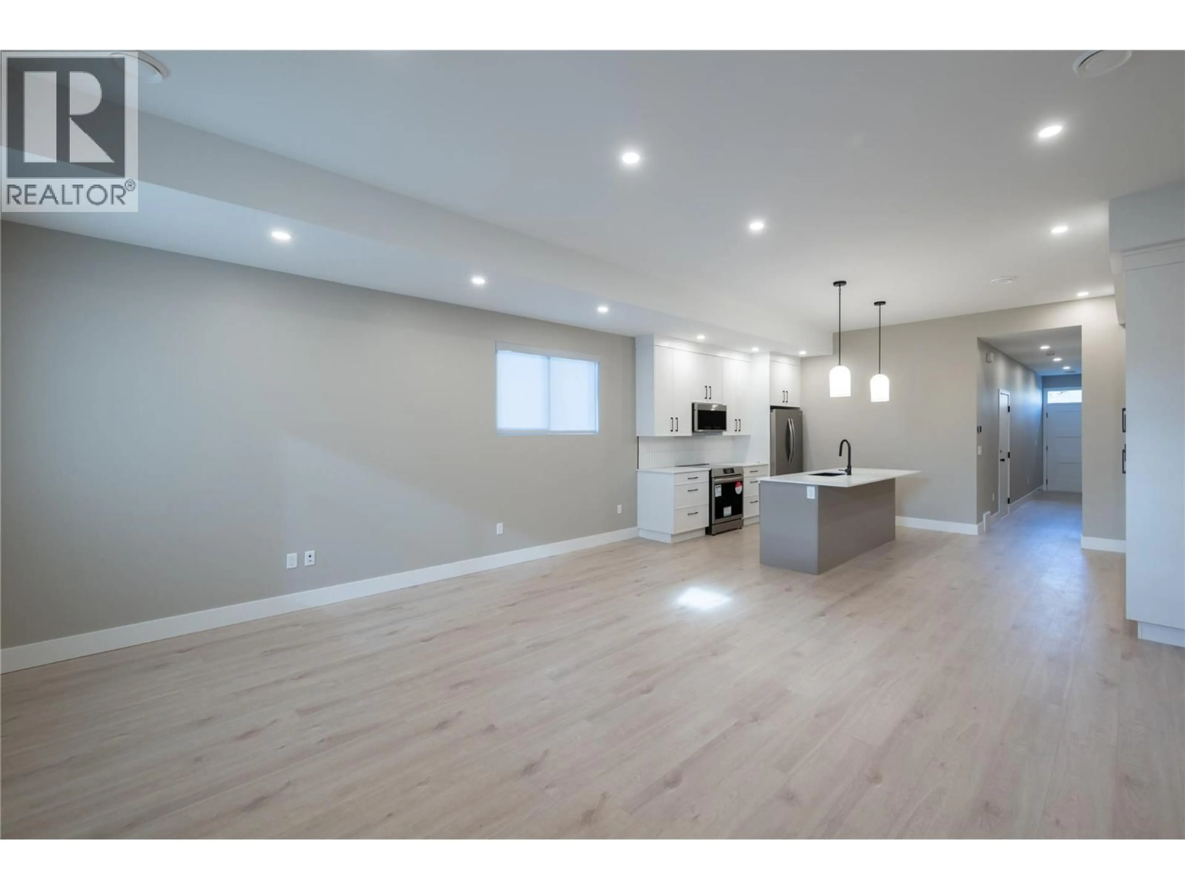 Open concept kitchen, wood/laminate floor for 159 CHESTNUT AVENUE, Kamloops British Columbia V2B1L3