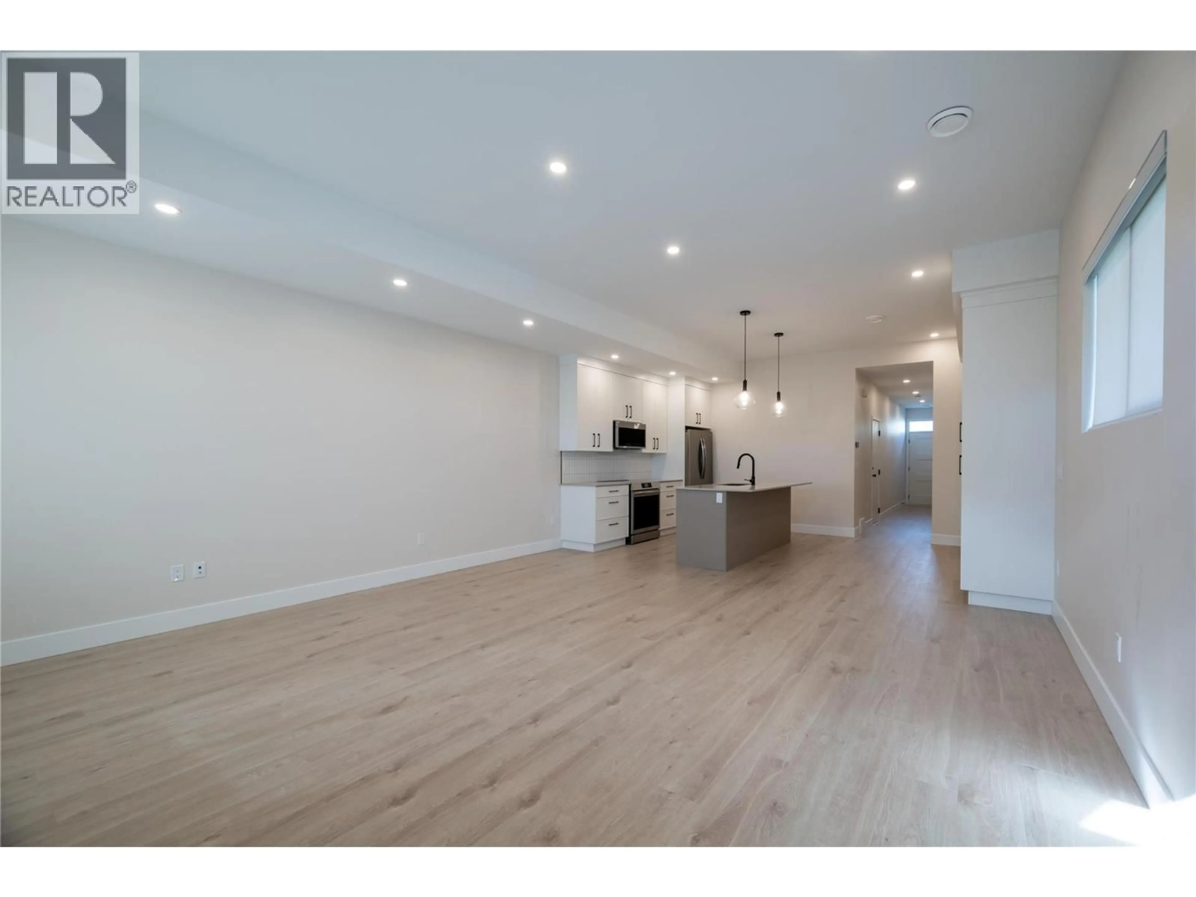 Open concept kitchen, wood/laminate floor for 165 CHESTNUT AVENUE, Kamloops British Columbia V2B1L3