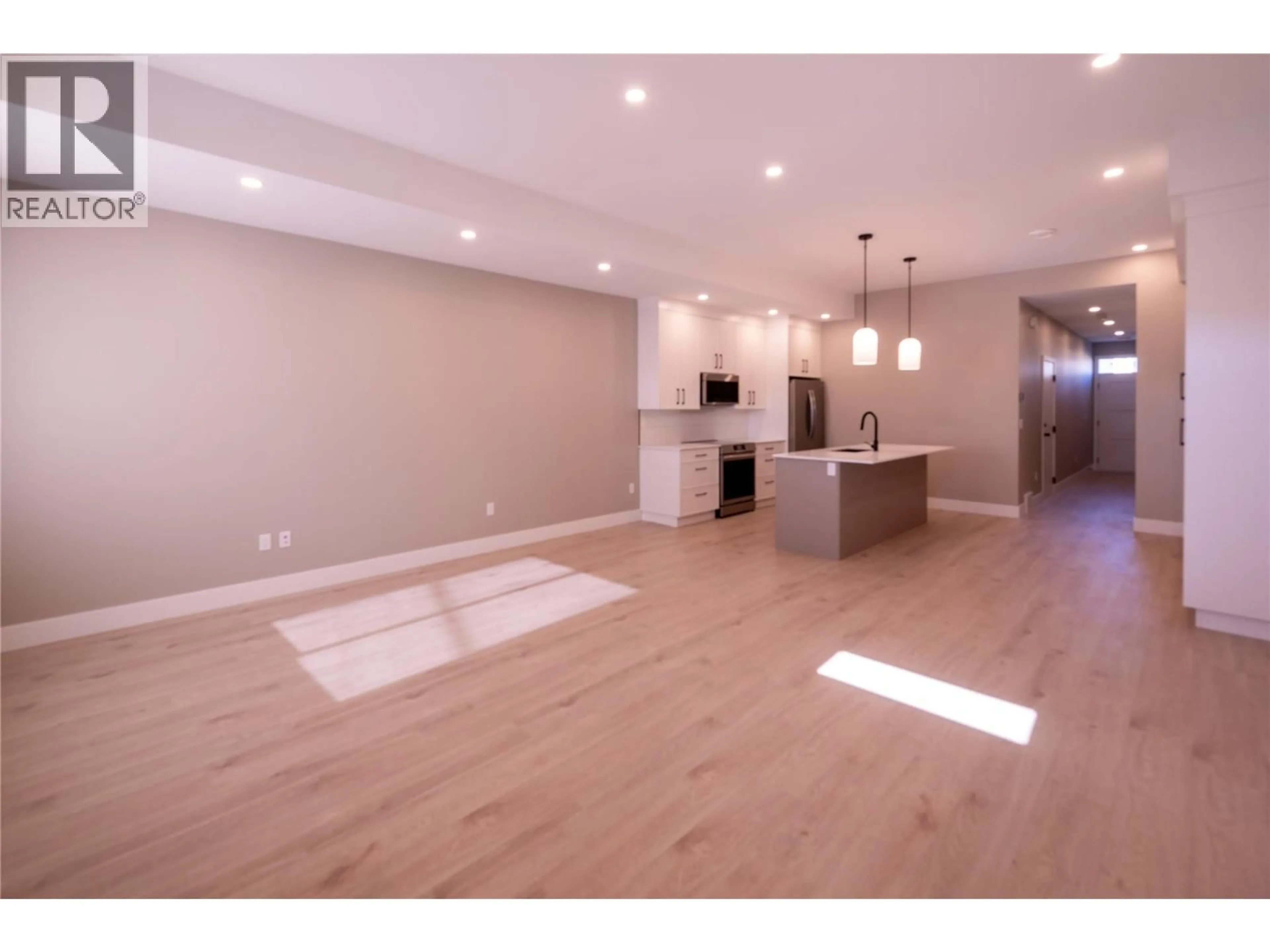 Open concept kitchen, wood/laminate floor for 161 CHESTNUT AVENUE, Kamloops British Columbia V2B1L3