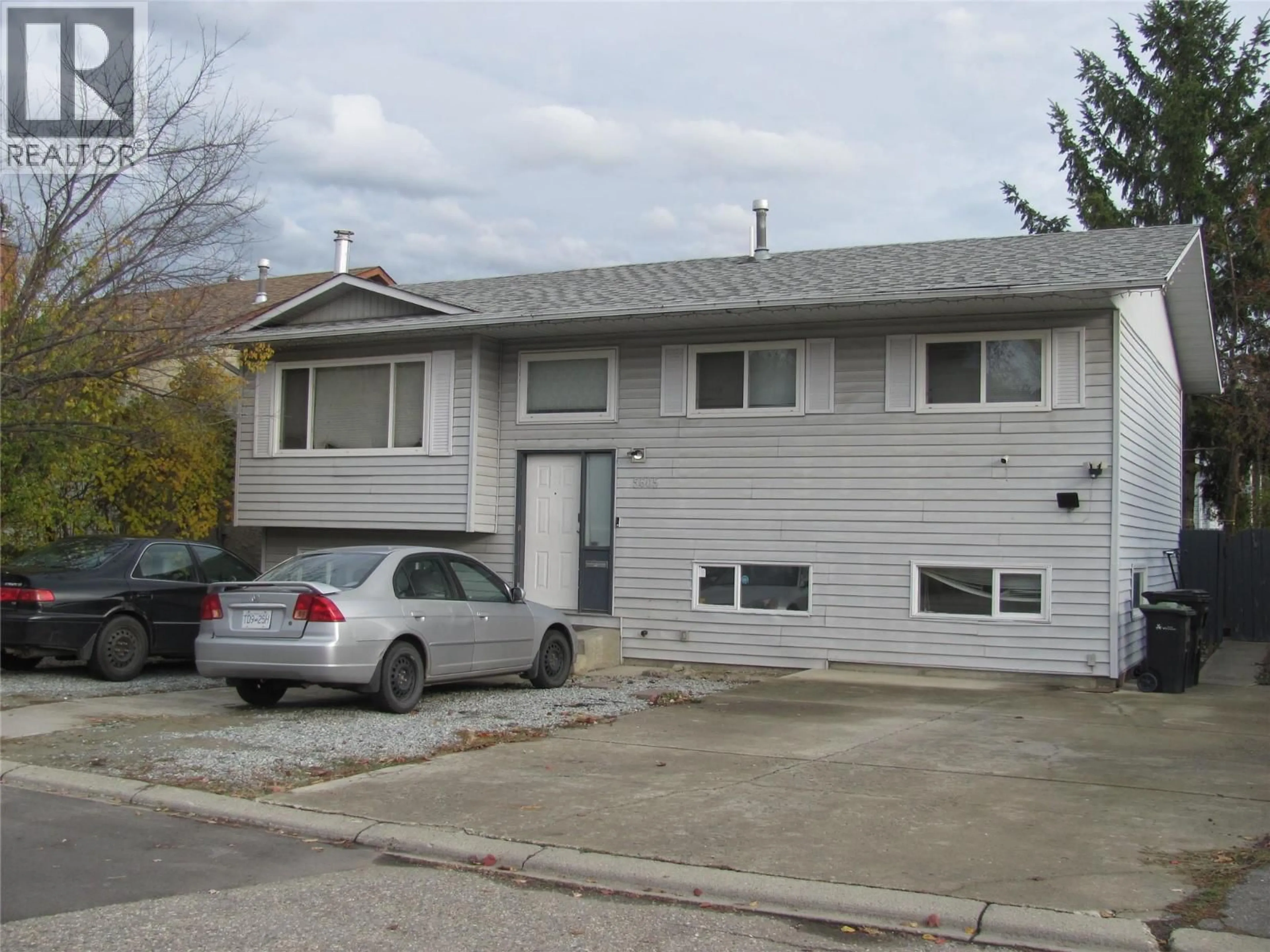 Home with vinyl exterior material, street for 5605 WILLOW DRIVE, Vernon British Columbia V1T7W3