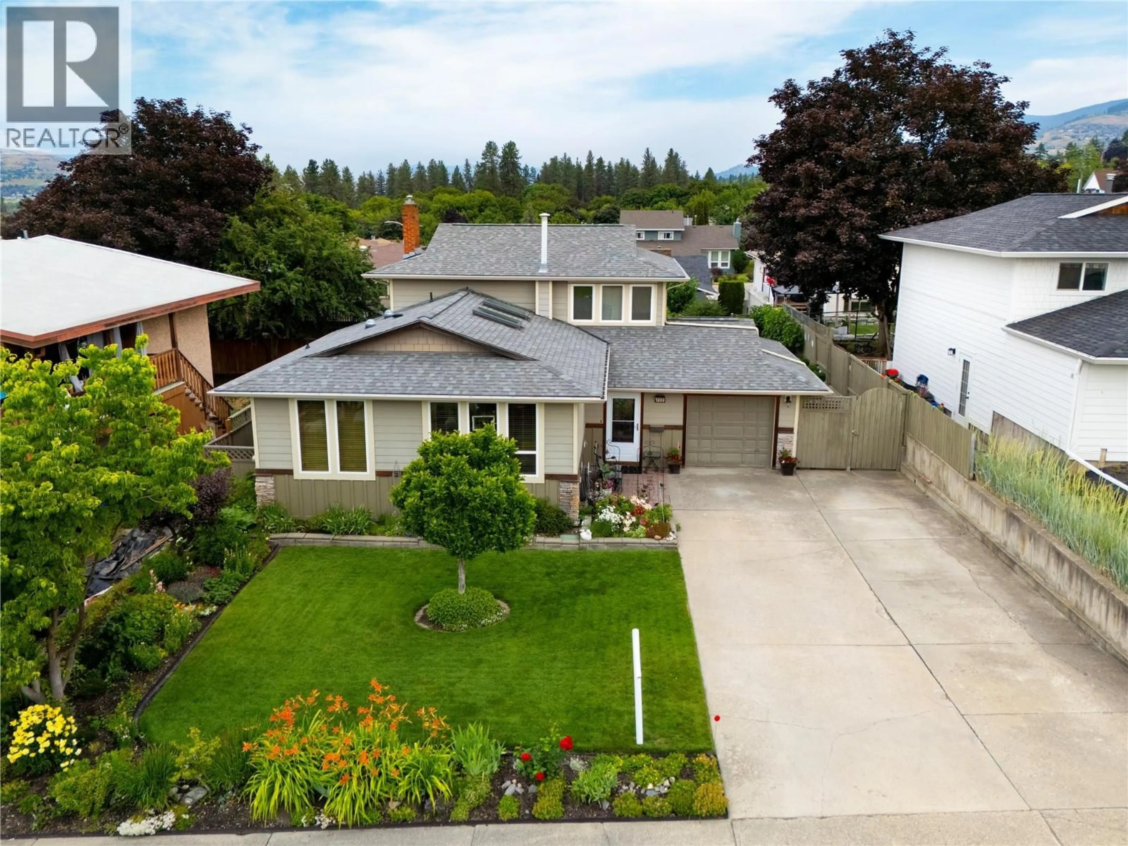 A pic from outside/outdoor area/front of a property/back of a property/a pic from drone, street for 1203 41 AVENUE, Vernon British Columbia V1T8A6