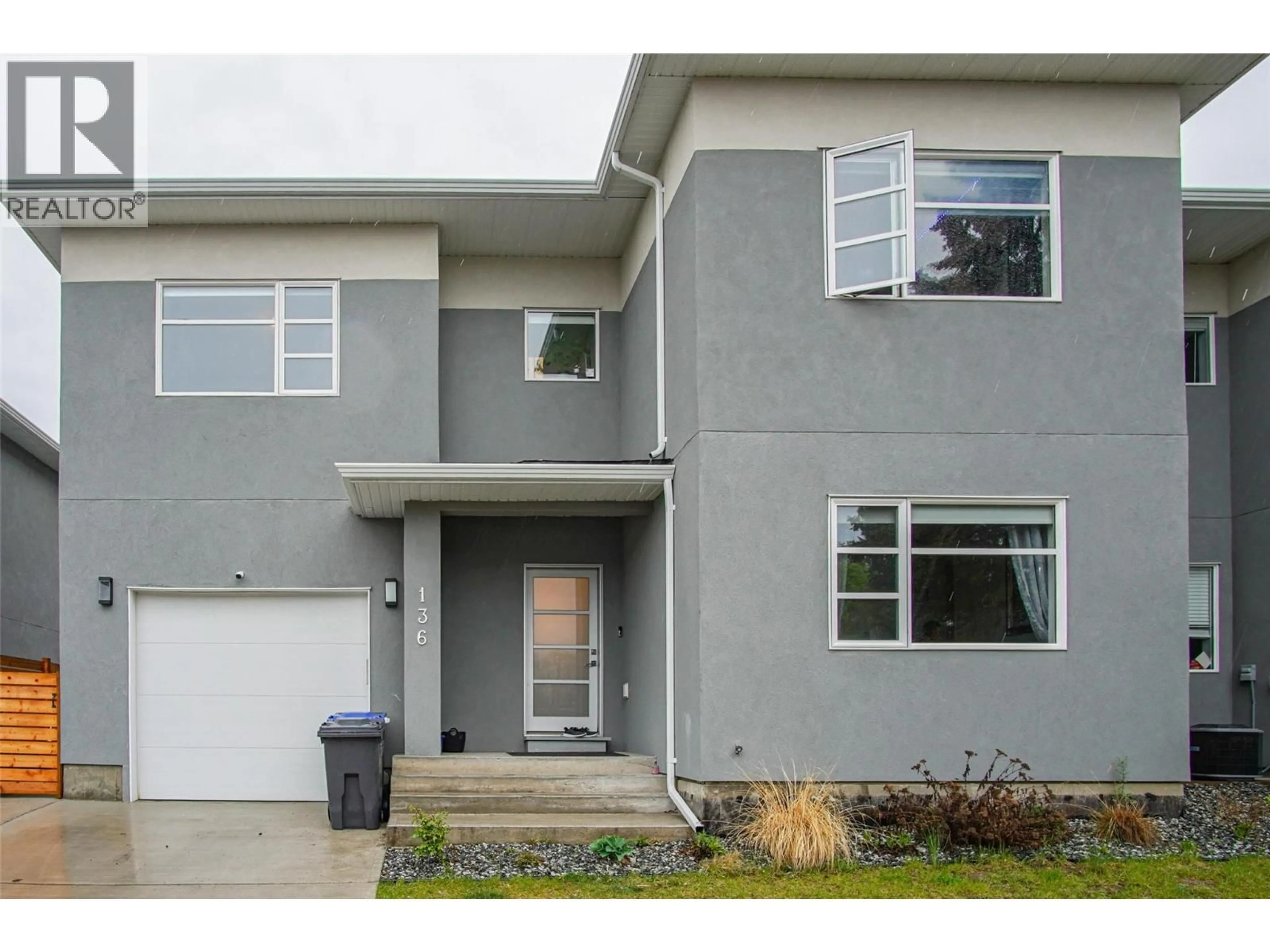 Home with vinyl exterior material, street for 136 MUGFORD ROAD, Kelowna British Columbia V1X3B3