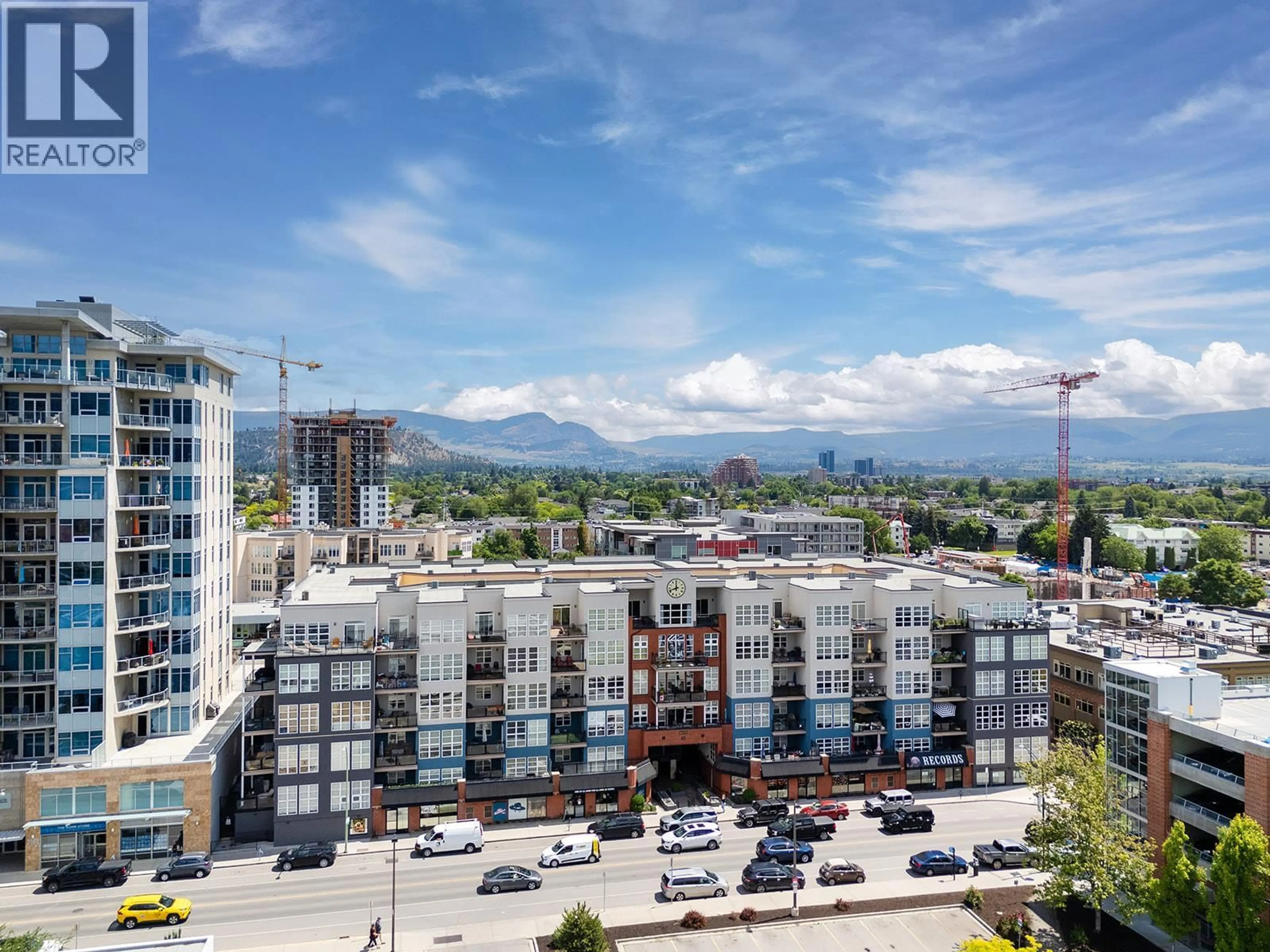 A pic from outside/outdoor area/front of a property/back of a property/a pic from drone, mountain view for 319 - 1331 ELLIS STREET, Kelowna British Columbia V1Y1Z9