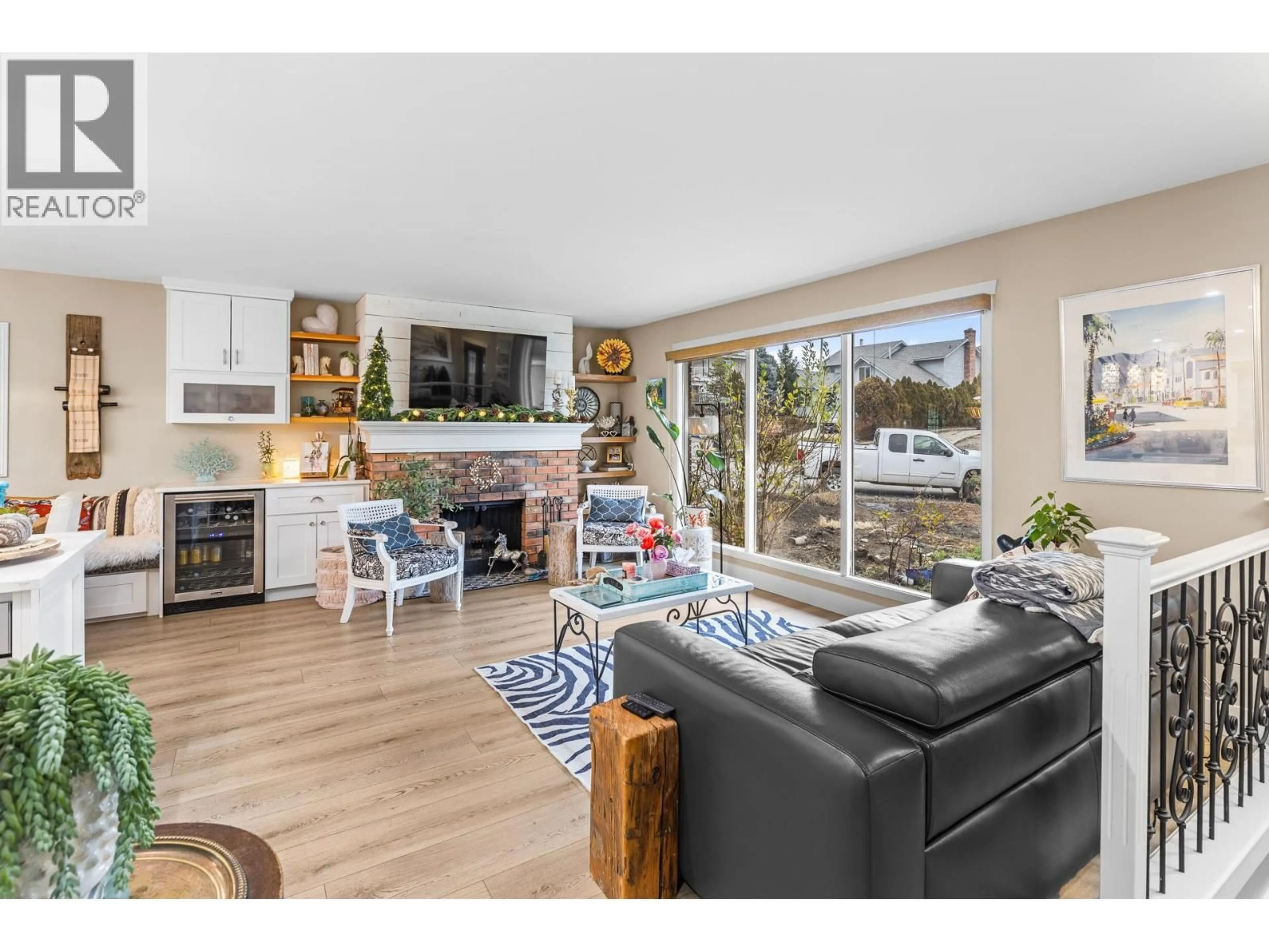 Living room with furniture, wood/laminate floor for 848 LIBAN COURT, Kelowna British Columbia V1Y8B5