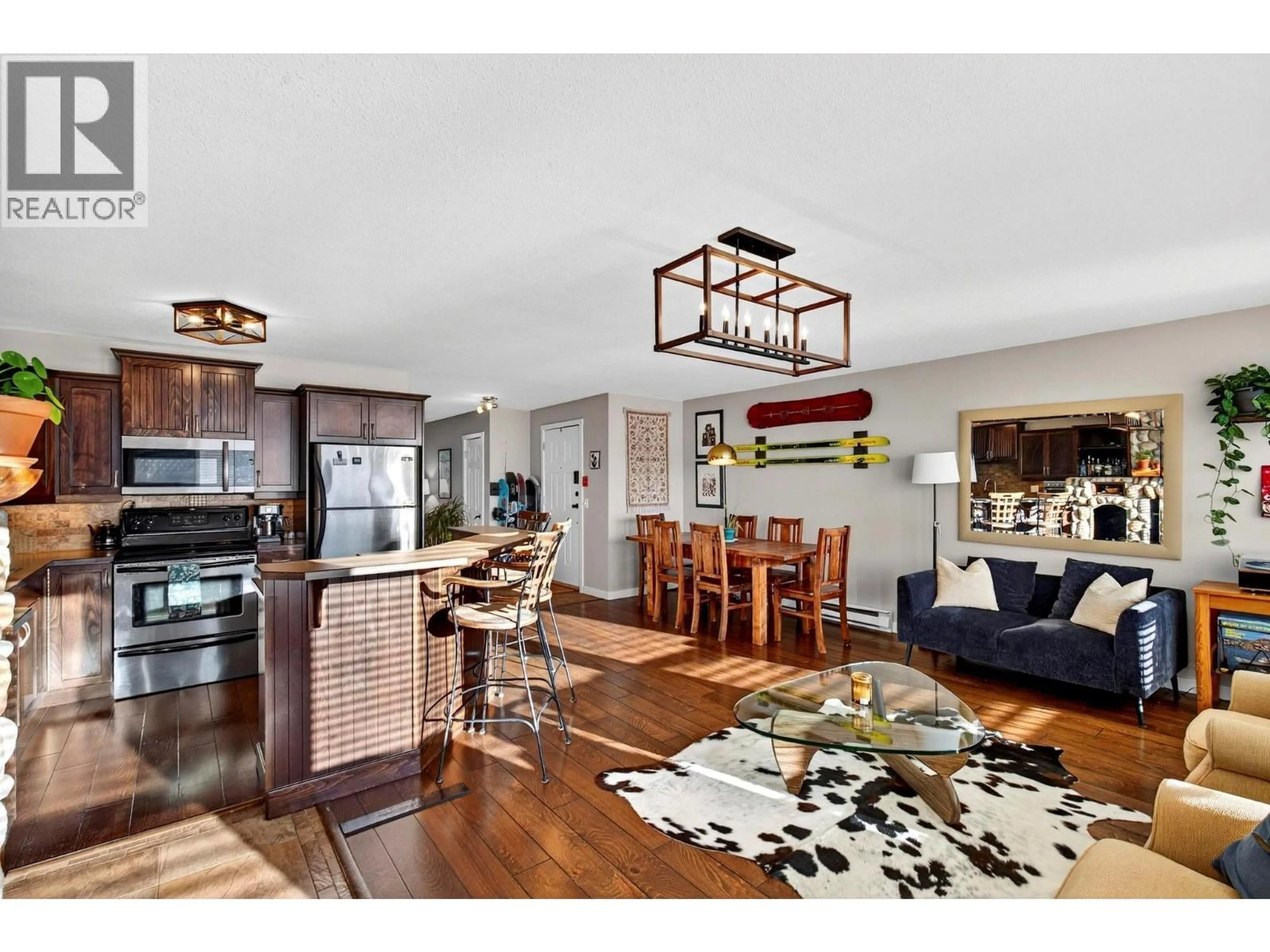 Open concept kitchen, wood/laminate floor for 104 - 7375 PORCUPINE ROAD, Big White British Columbia V1P1P3