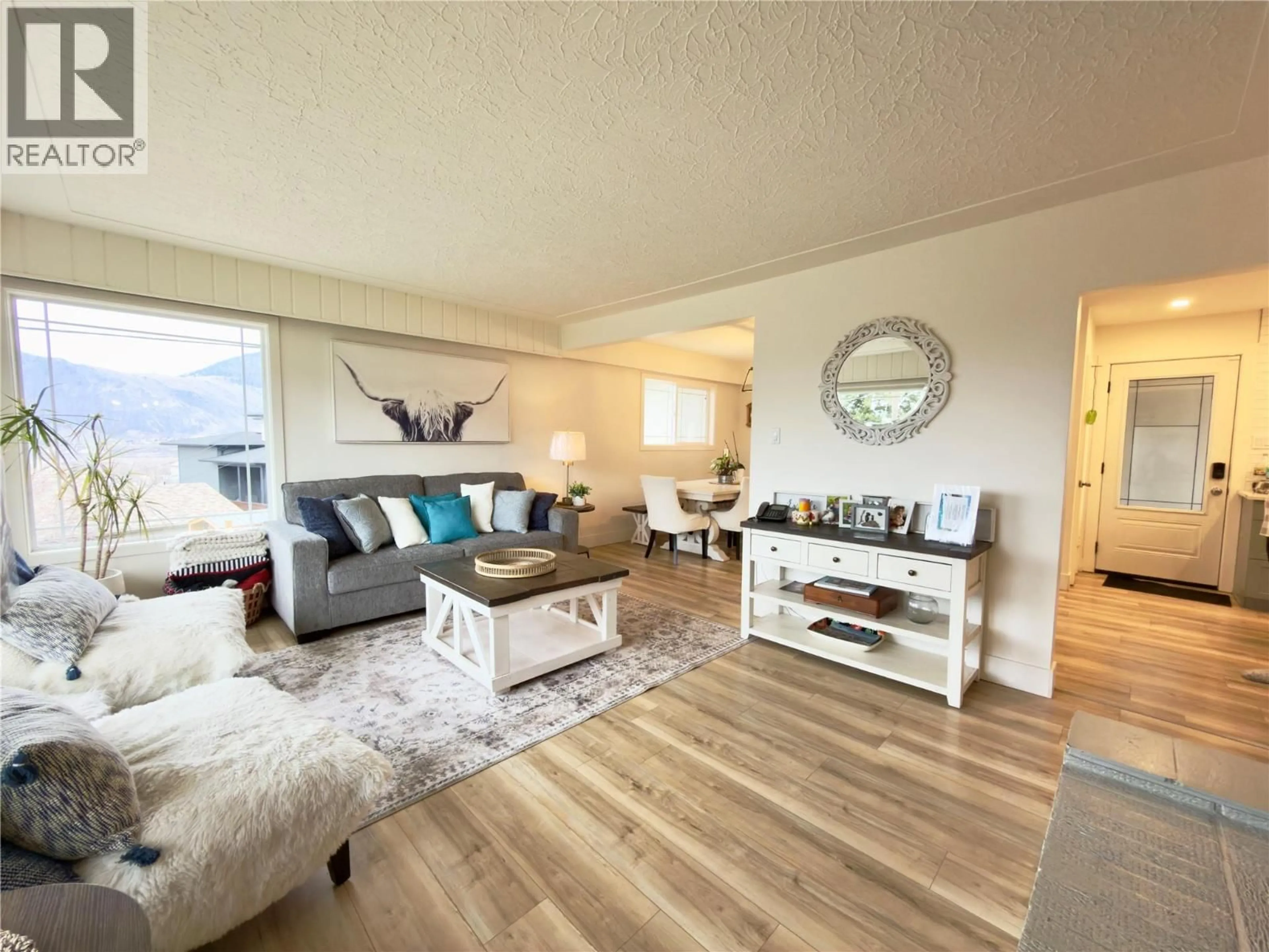 Living room with furniture, wood/laminate floor for 1515 ROBINSON CRESCENT, Kamloops British Columbia V2C3J2