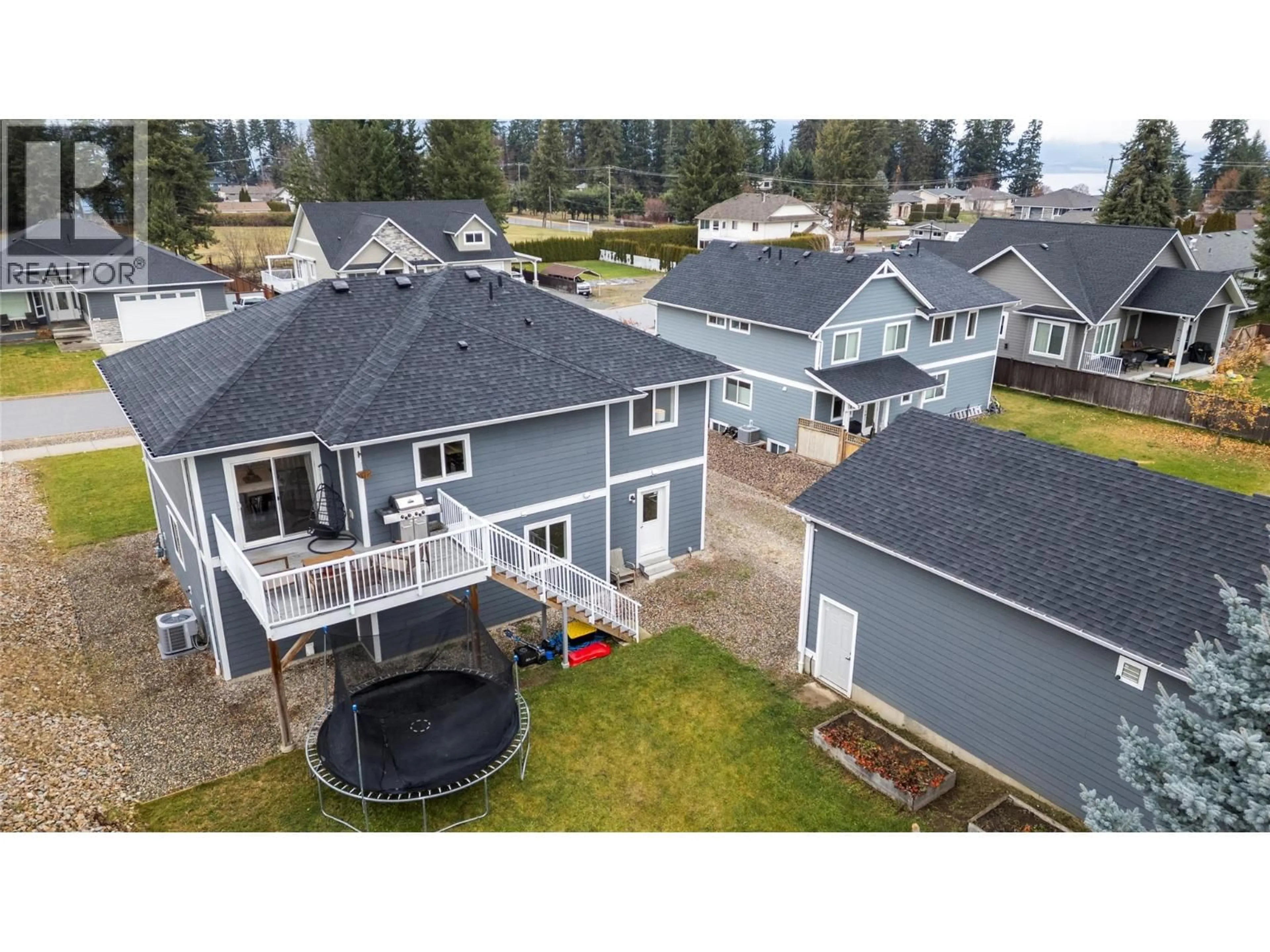 A pic from outside/outdoor area/front of a property/back of a property/a pic from drone, water/lake/river/ocean view for 1140 23 STREET SOUTHEAST, Salmon Arm British Columbia V1E0C7
