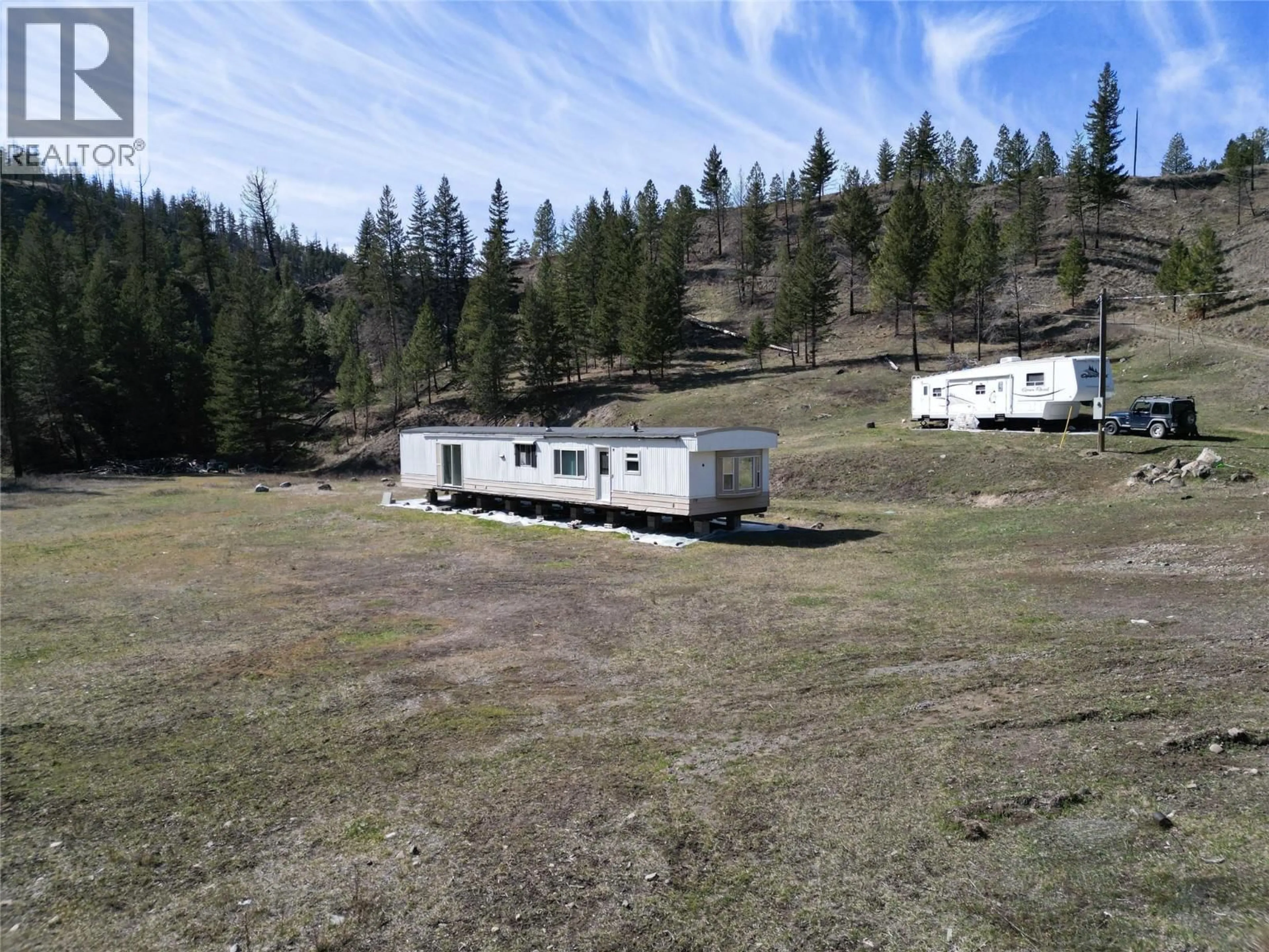 A pic from outside/outdoor area/front of a property/back of a property/a pic from drone, mountain view for 1280 RENSCH ROAD, Loon Lake British Columbia V0K1H1