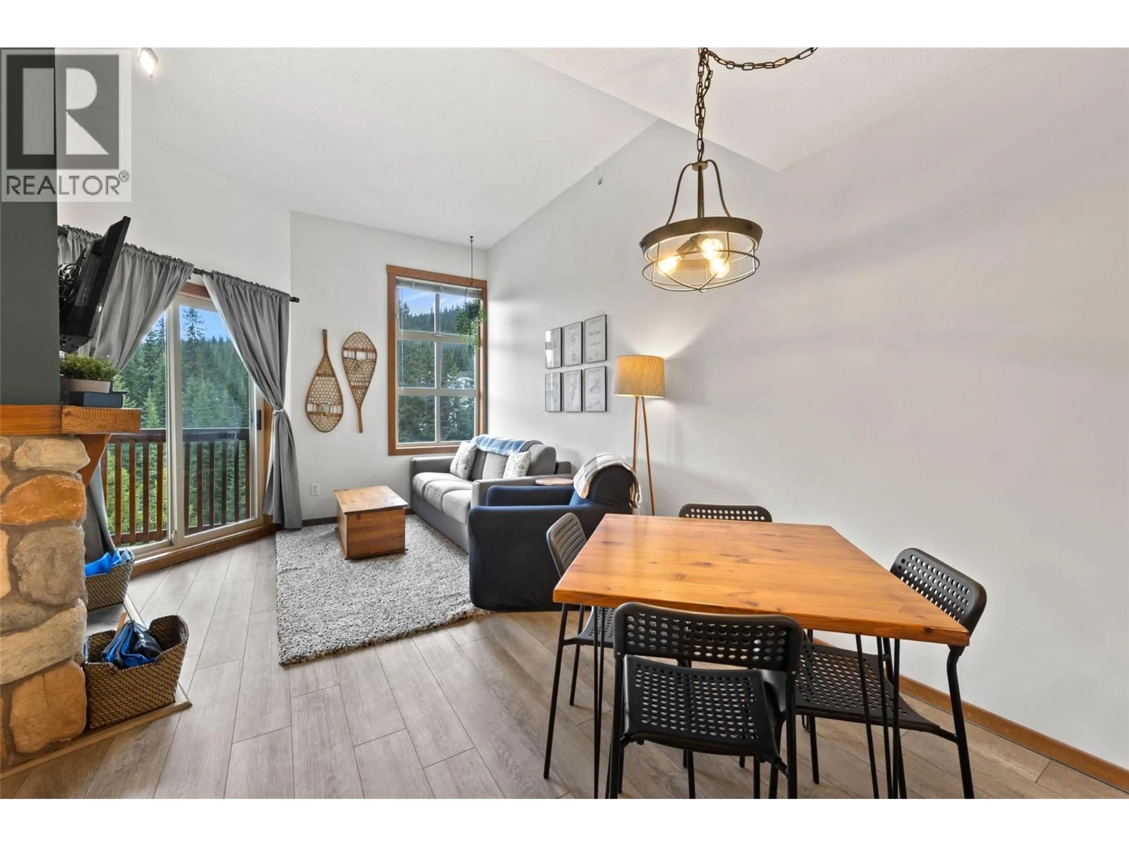 Living room with furniture, wood/laminate floor for 420 - 3190 CREEKSIDE WAY, Sun Peaks British Columbia V0E5N0