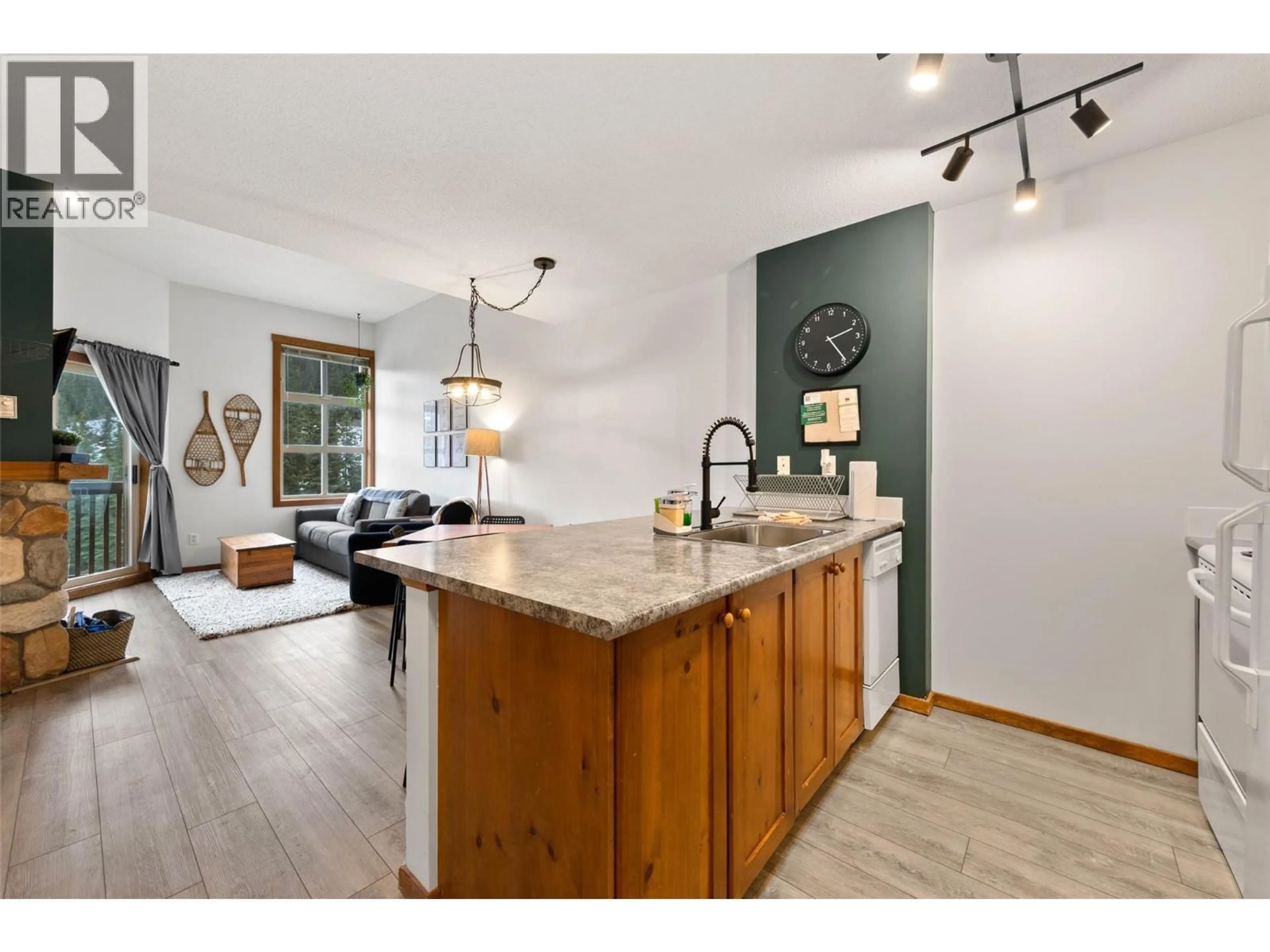 Open concept kitchen, wood/laminate floor for 420 - 3190 CREEKSIDE WAY, Sun Peaks British Columbia V0E5N0