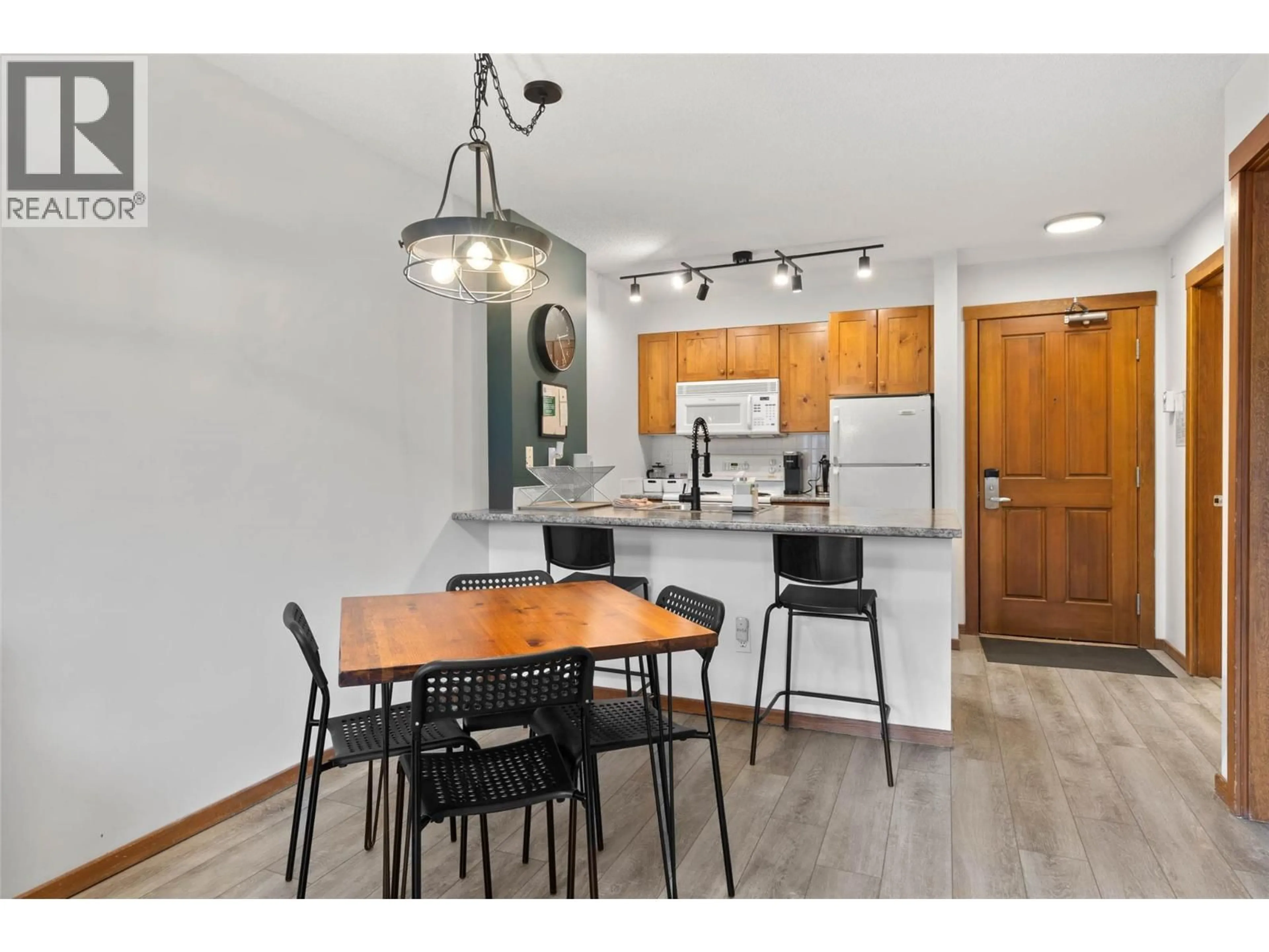 Open concept kitchen, wood/laminate floor for 420 - 3190 CREEKSIDE WAY, Sun Peaks British Columbia V0E5N0