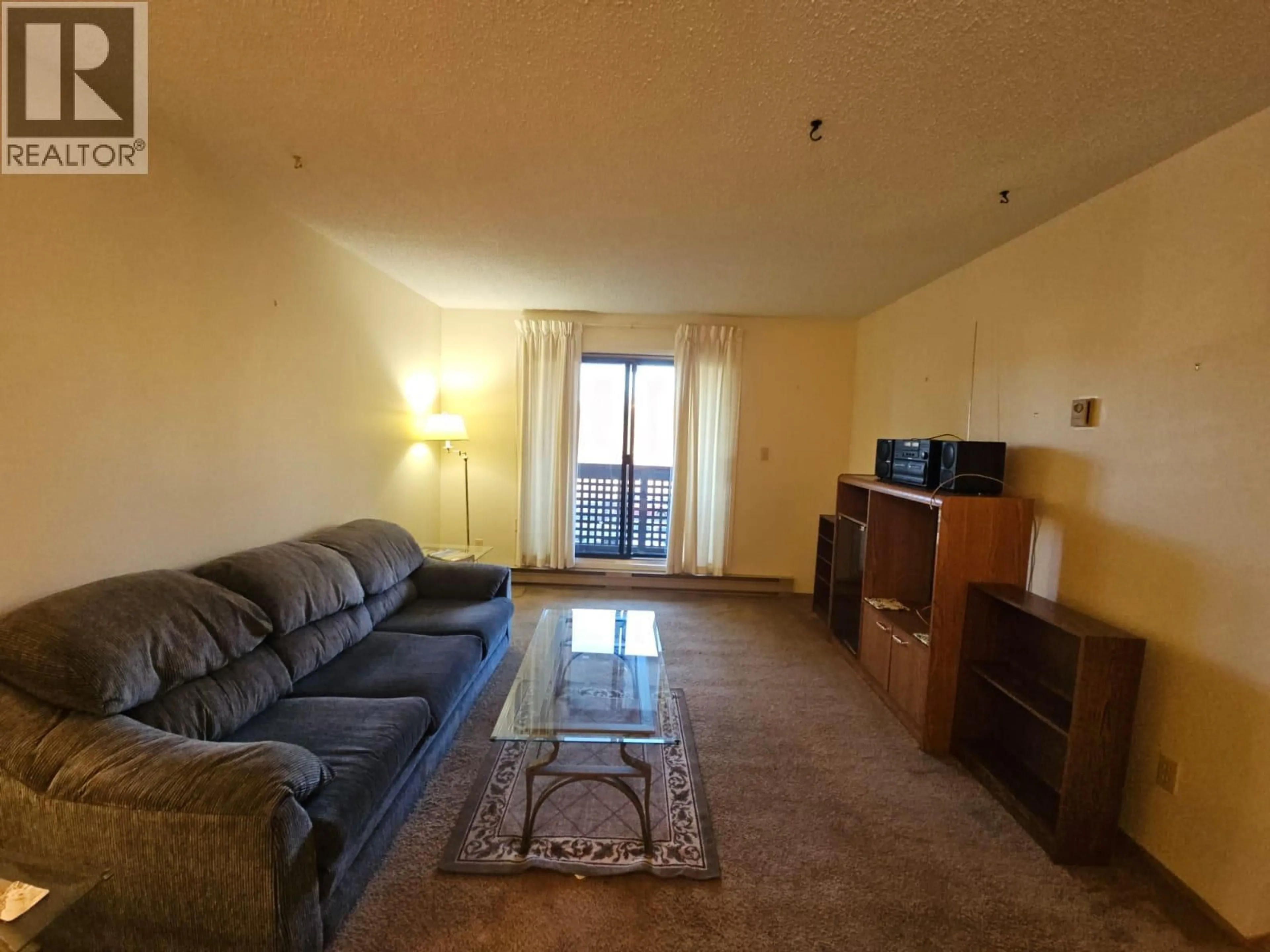 Living room with furniture, unknown for 307-195 CHAMBERLAIN CRESCENT, Tumbler Ridge British Columbia V0C2W0