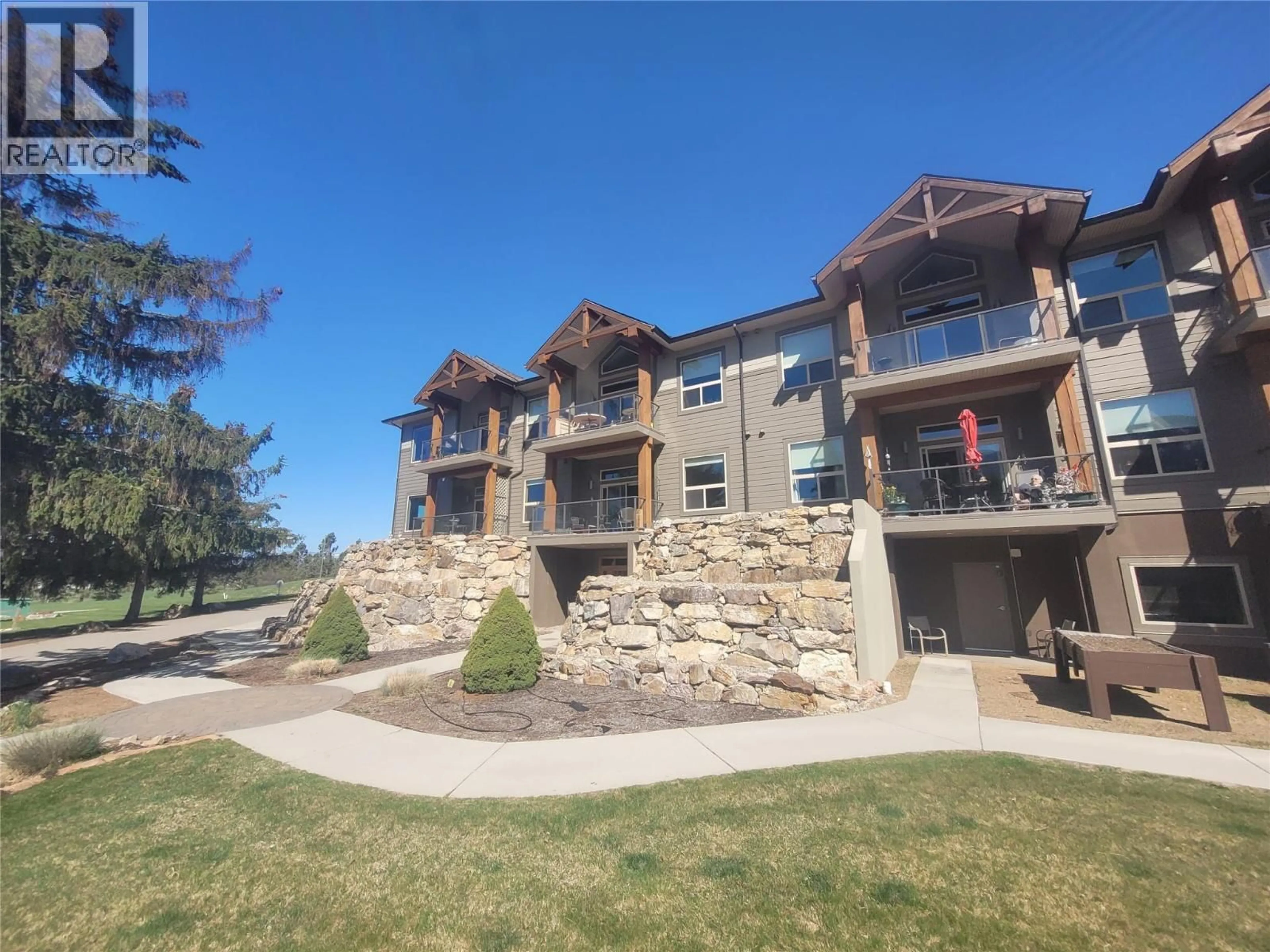 A pic from outside/outdoor area/front of a property/back of a property/a pic from drone, unknown for 104 - 9100 MACKIE DRIVE, Coldstream British Columbia V1B1G9