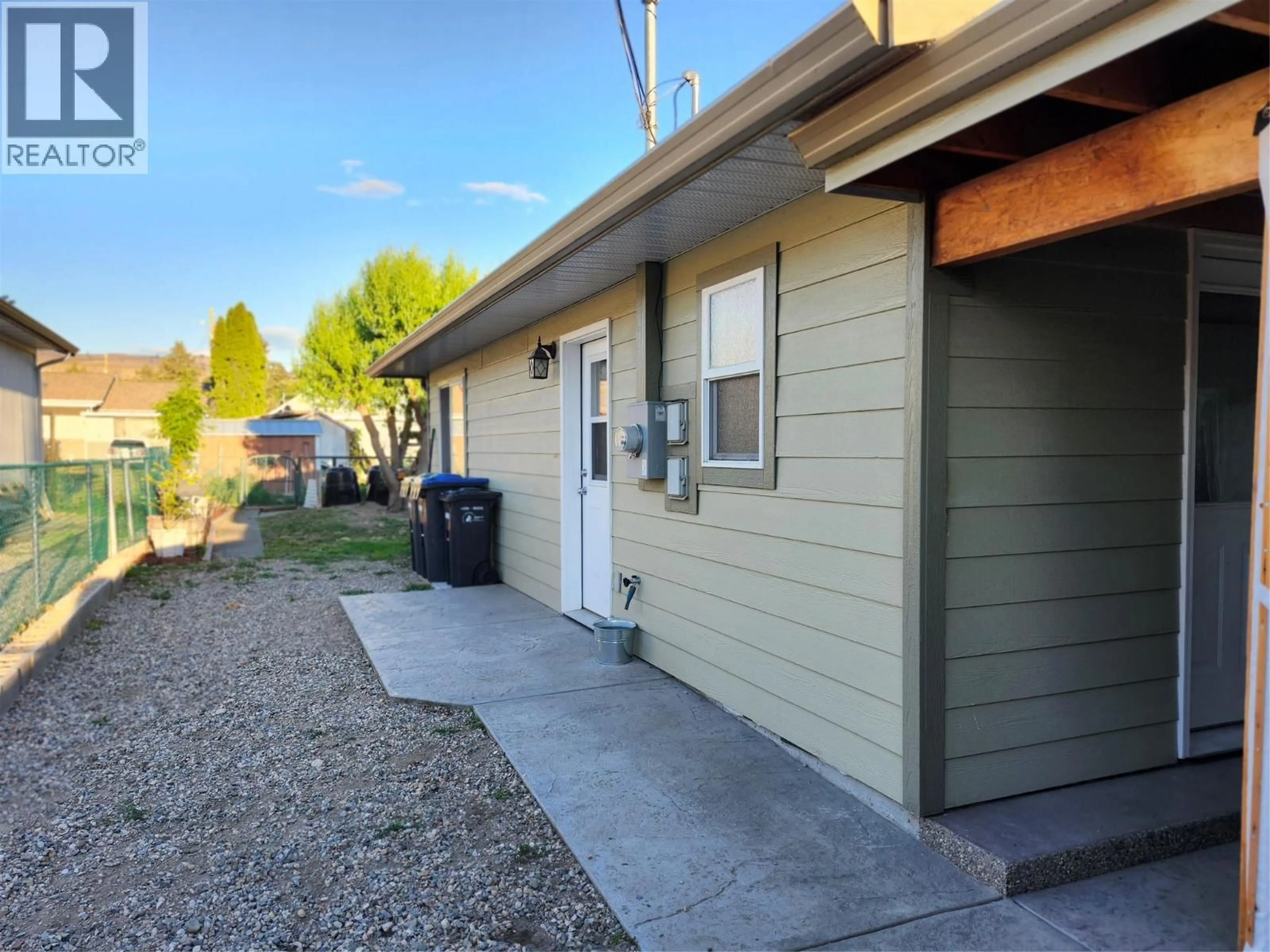 Home with vinyl exterior material, street for 6453 PARK DRIVE, Oliver British Columbia V0H1T3