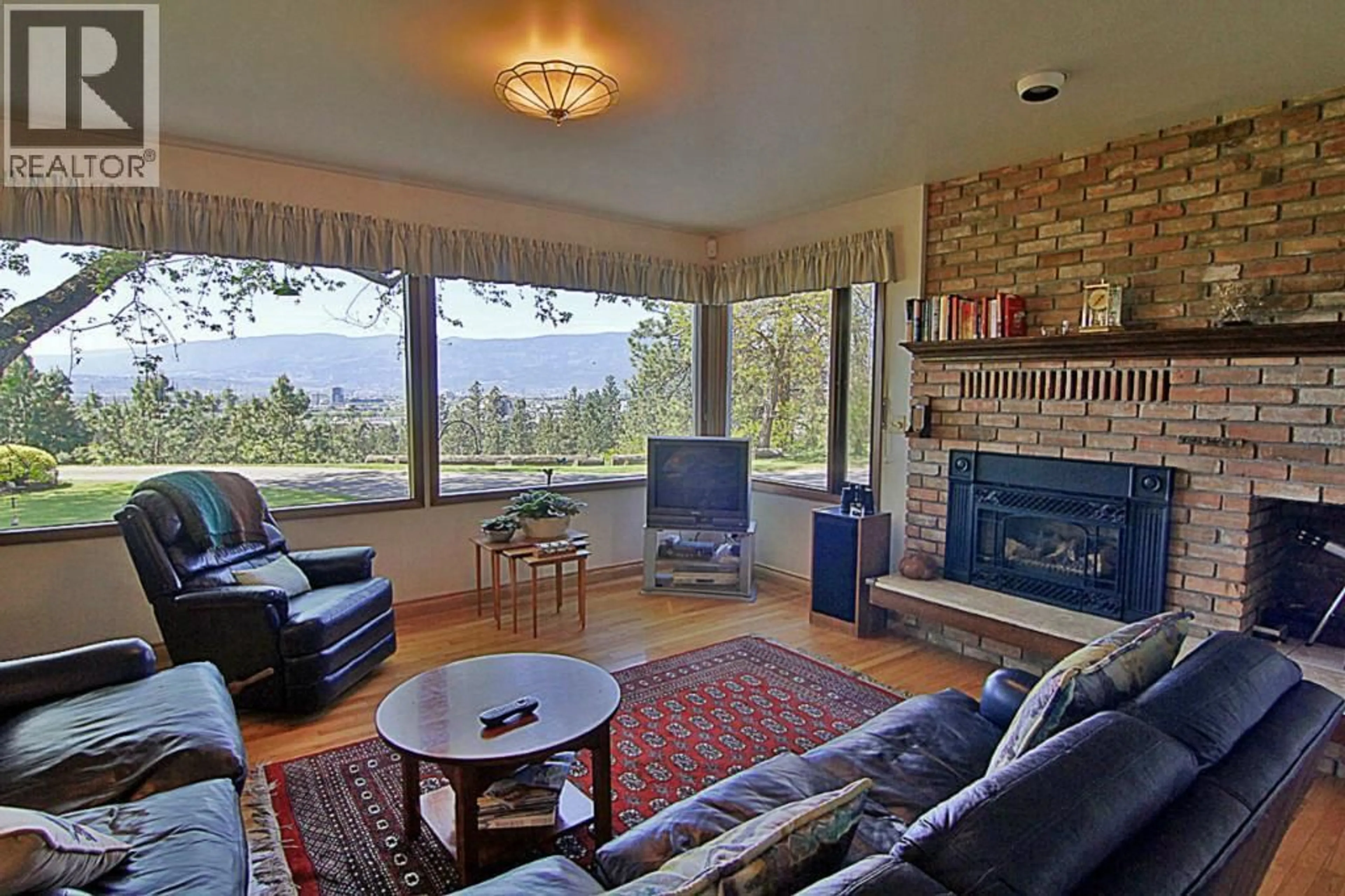 Living room with furniture, ceramic/tile floor for 2990 DUNSTER ROAD, Kelowna British Columbia V1W4H4