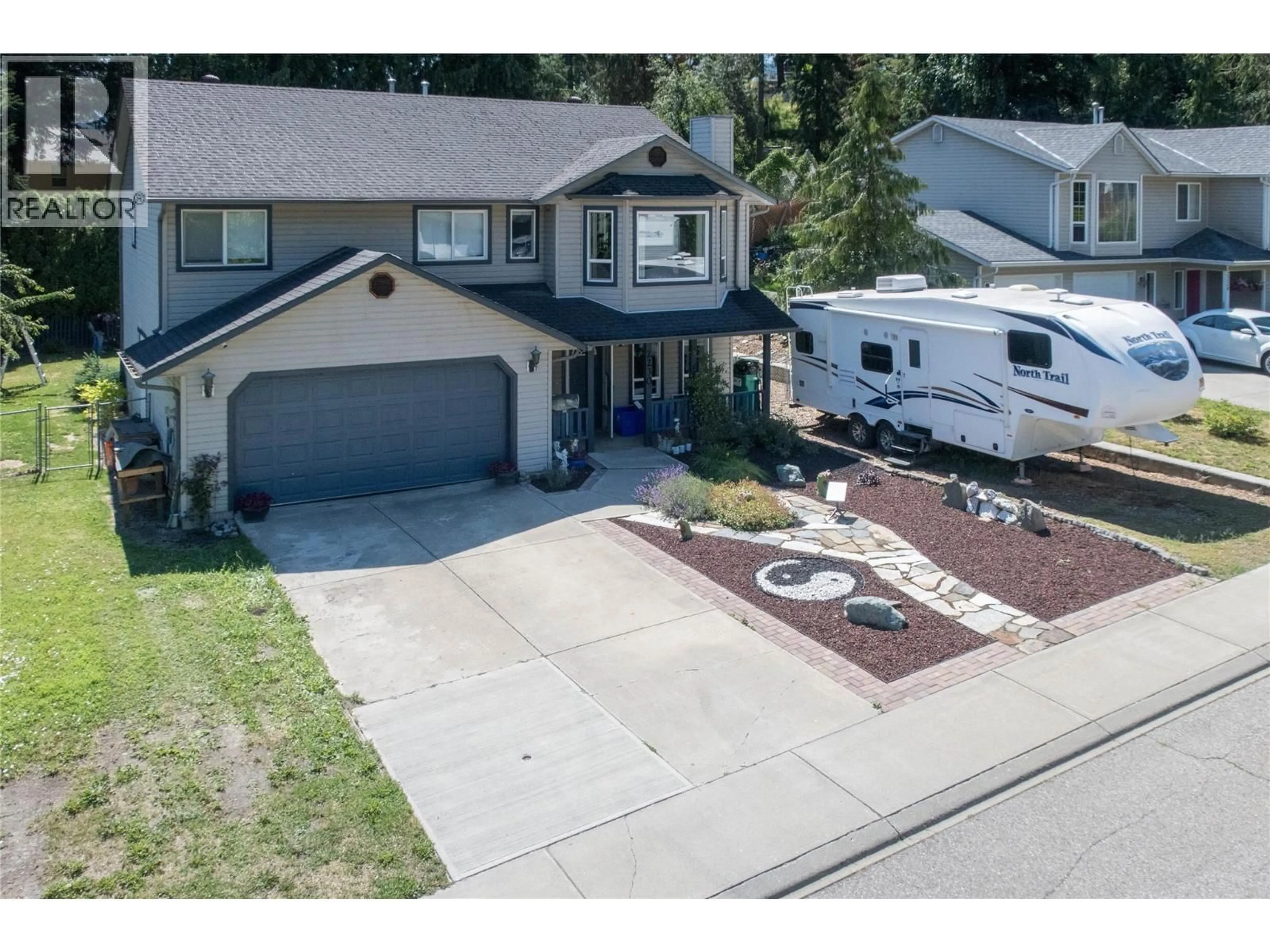 A pic from outside/outdoor area/front of a property/back of a property/a pic from drone, street for 2230 LINEA CRESCENT, Lumby British Columbia V0E2G0