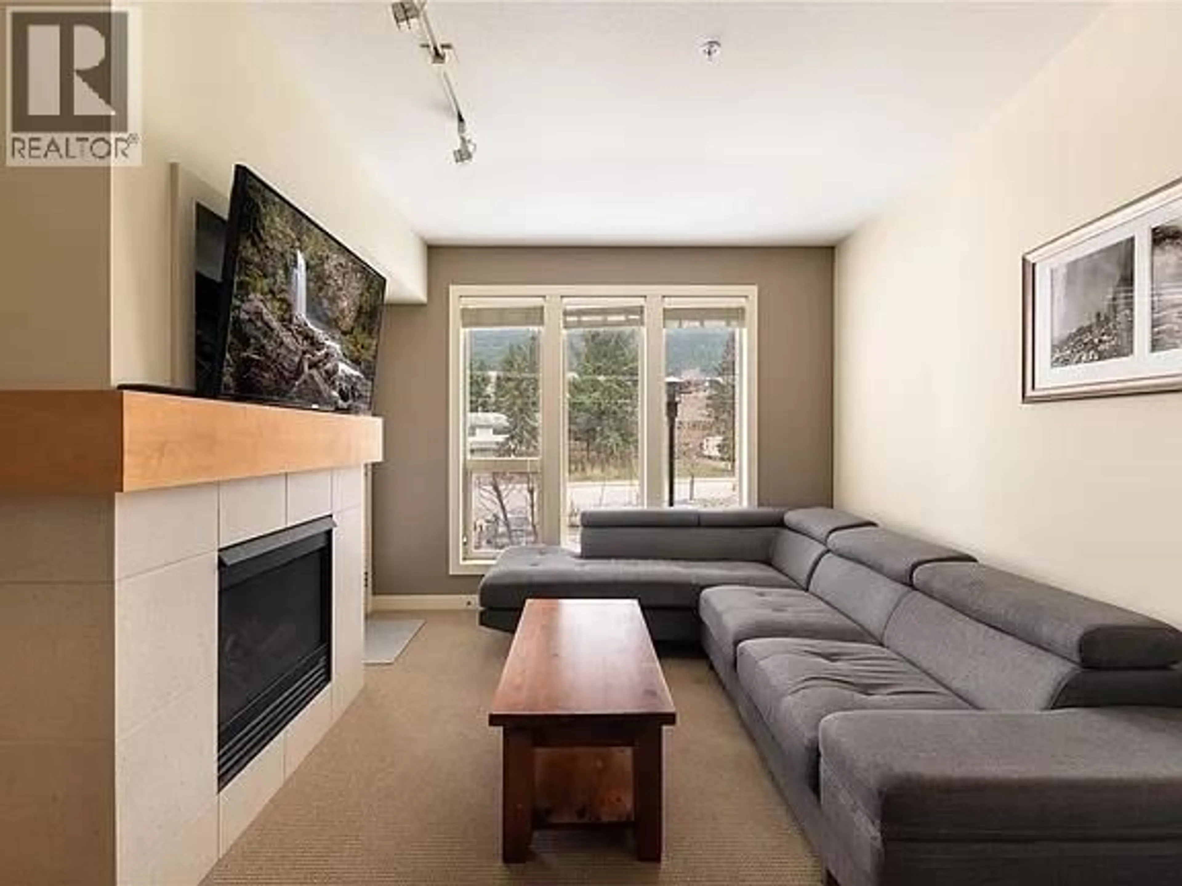 Living room with furniture, unknown for 2204 - 7343 OKANAGAN LANDING ROAD, Vernon British Columbia V1H2J6