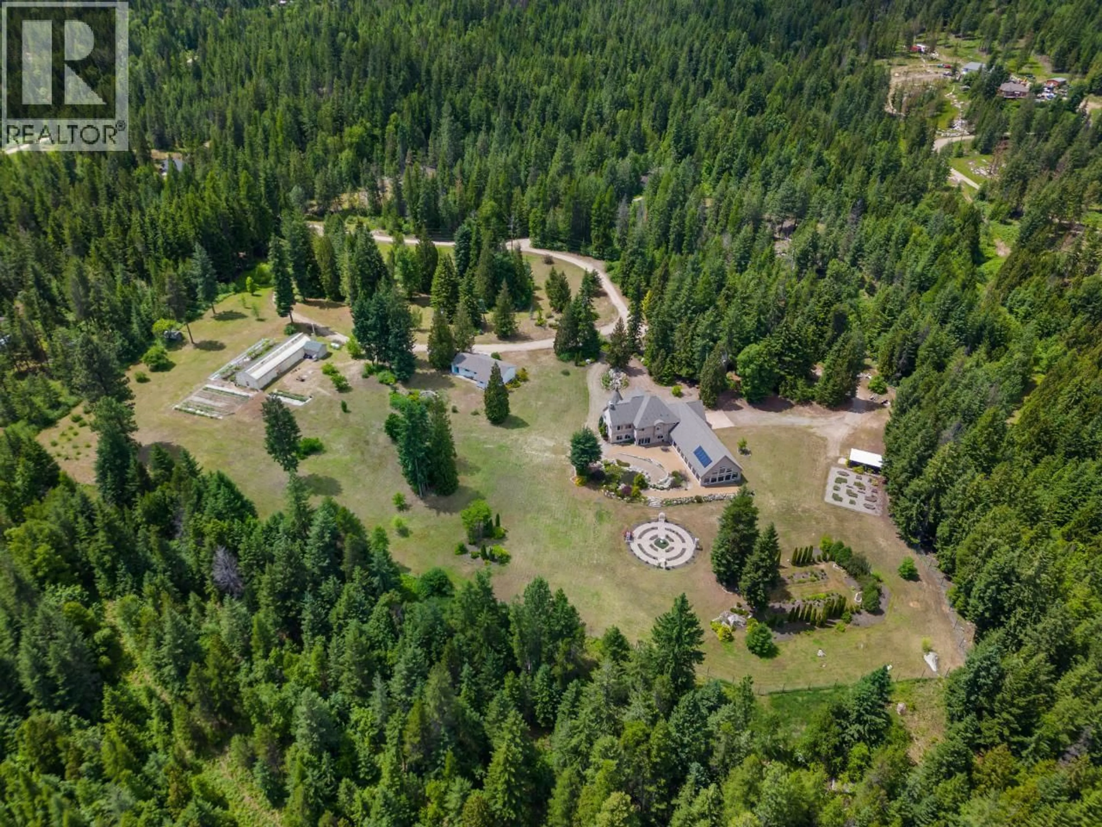 A pic from outside/outdoor area/front of a property/back of a property/a pic from drone, forest/trees view for 1480 NIGHTHAWK DRIVE, Castlegar British Columbia V1N4S2