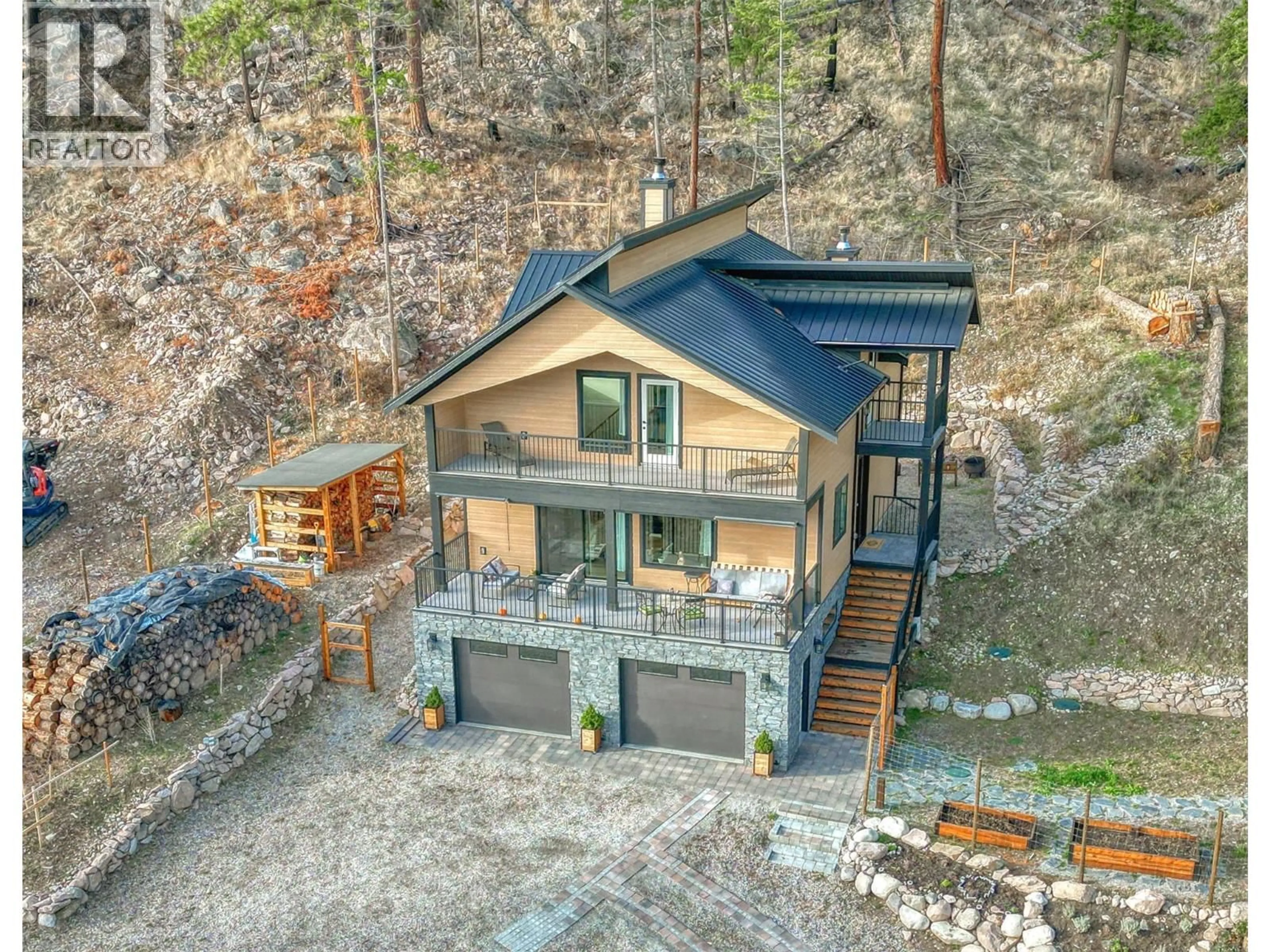 A pic from outside/outdoor area/front of a property/back of a property/a pic from drone, water/lake/river/ocean view for 634 UDELL ROAD, Vernon British Columbia V1H2G3