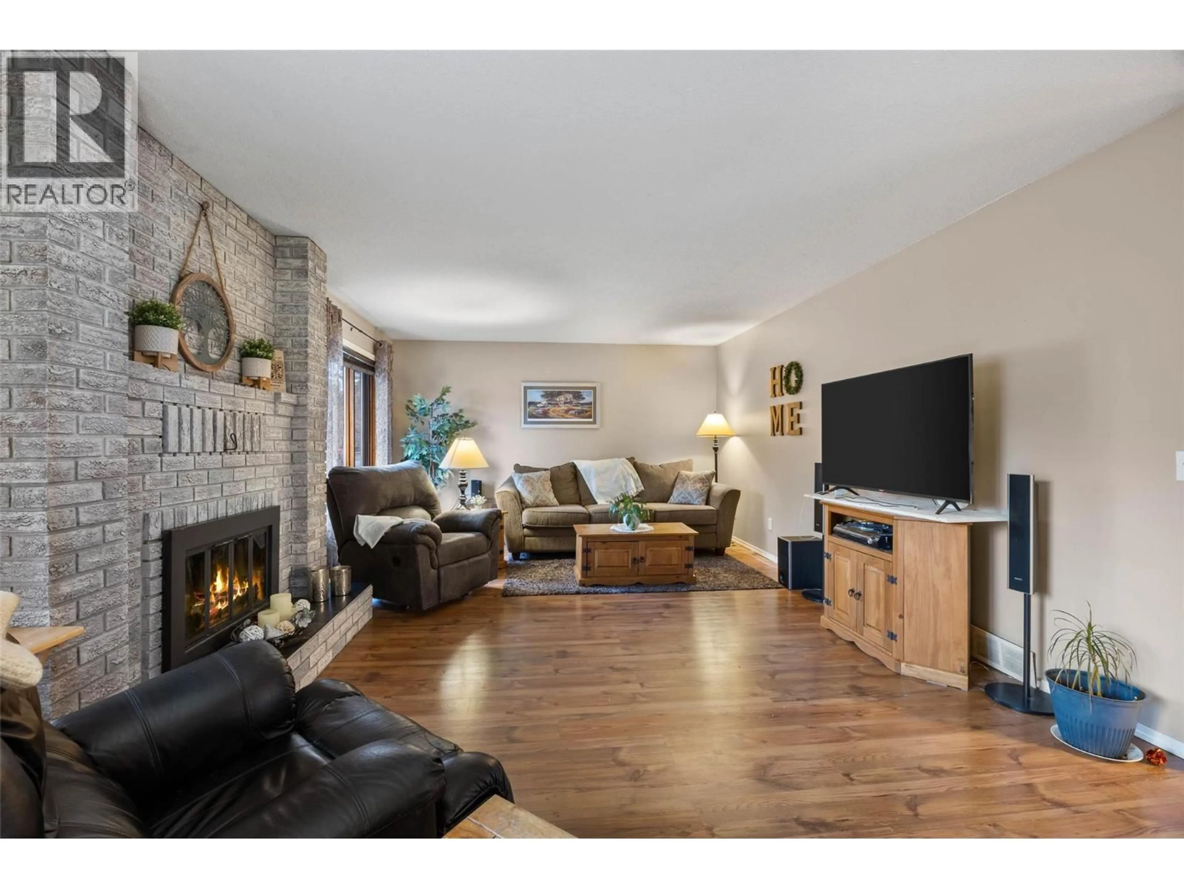 Living room with furniture, wood/laminate floor for 4154 CAMERON ROAD, Kamloops British Columbia V2H1K9