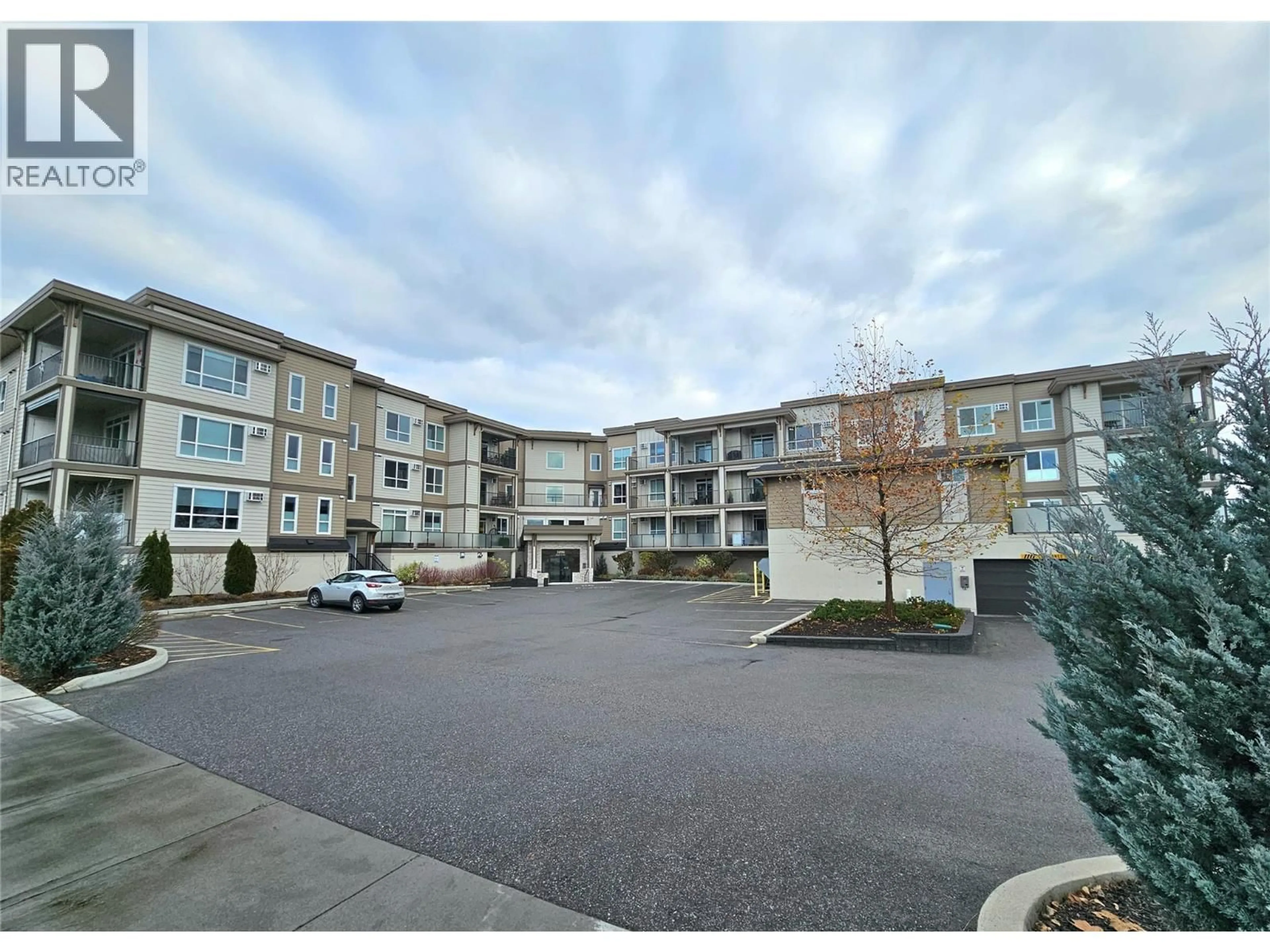 A pic from outside/outdoor area/front of a property/back of a property/a pic from drone, unknown for 308 - 3090 BURTCH ROAD, Kelowna British Columbia V1W5G9