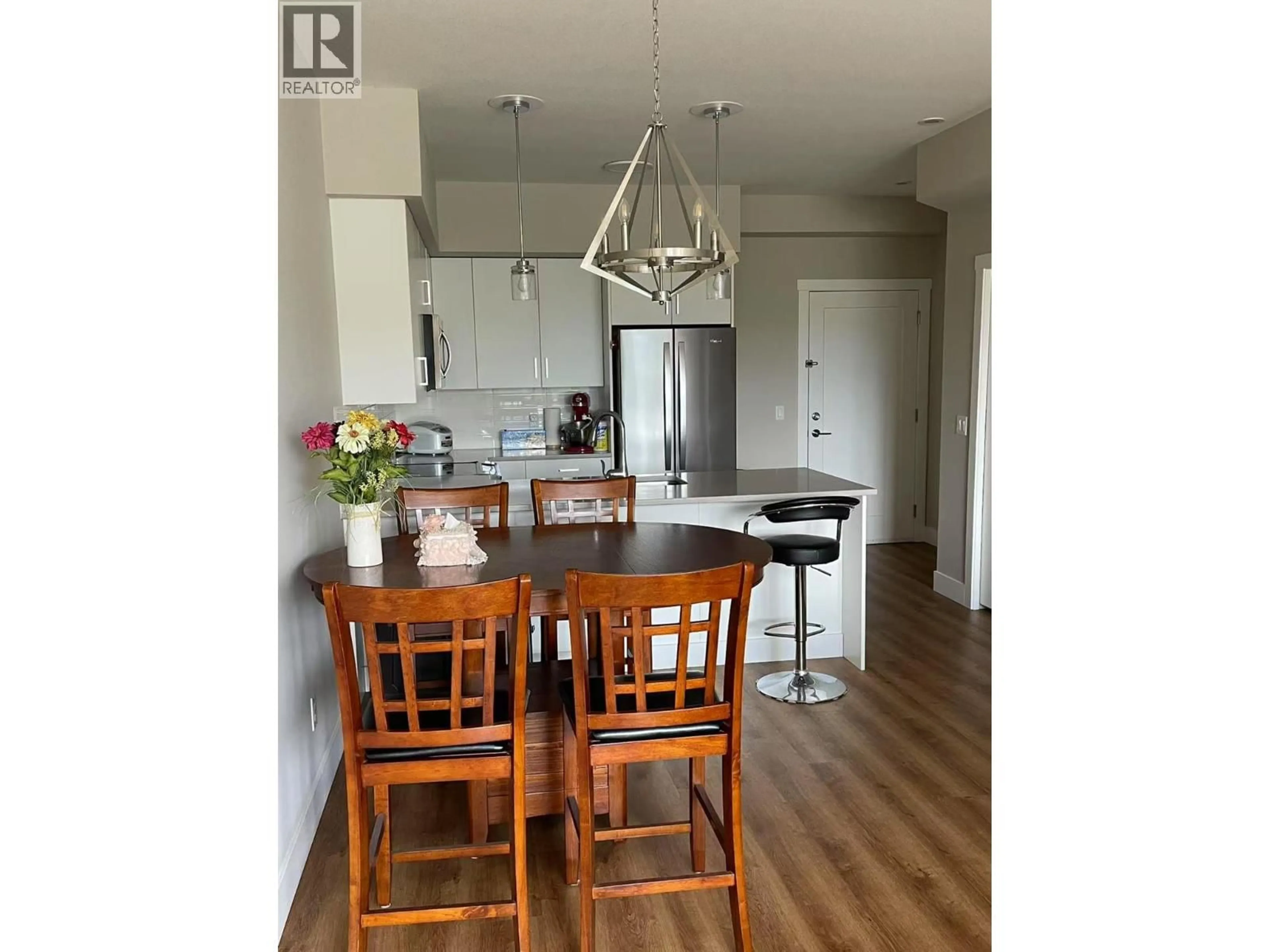 Open concept kitchen, wood/laminate floor for 308 - 3090 BURTCH ROAD, Kelowna British Columbia V1W5G9