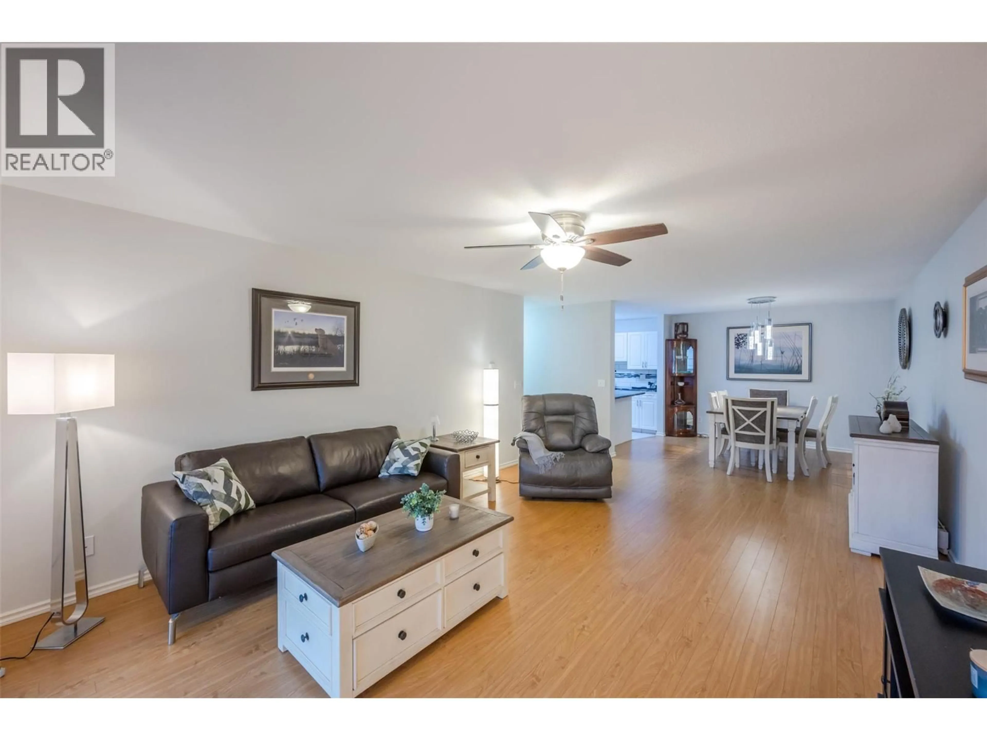 Living room with furniture, wood/laminate floor for 103 - 1820 ATKINSON STREET, Penticton British Columbia V2A7M6