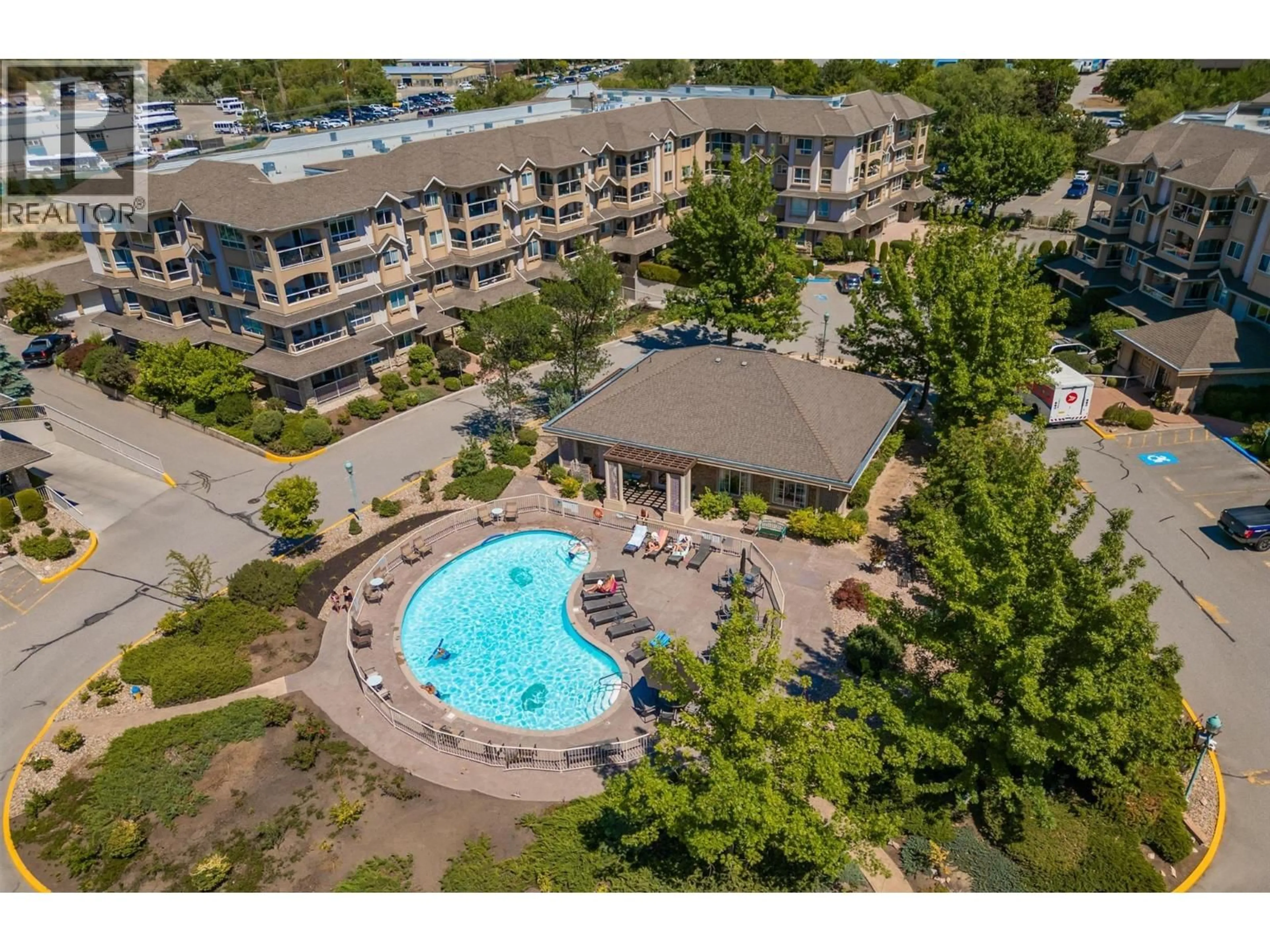 A pic from outside/outdoor area/front of a property/back of a property/a pic from drone, water/lake/river/ocean view for 309 - 1964 ENTERPRISE WAY, Kelowna British Columbia V1Y9S7