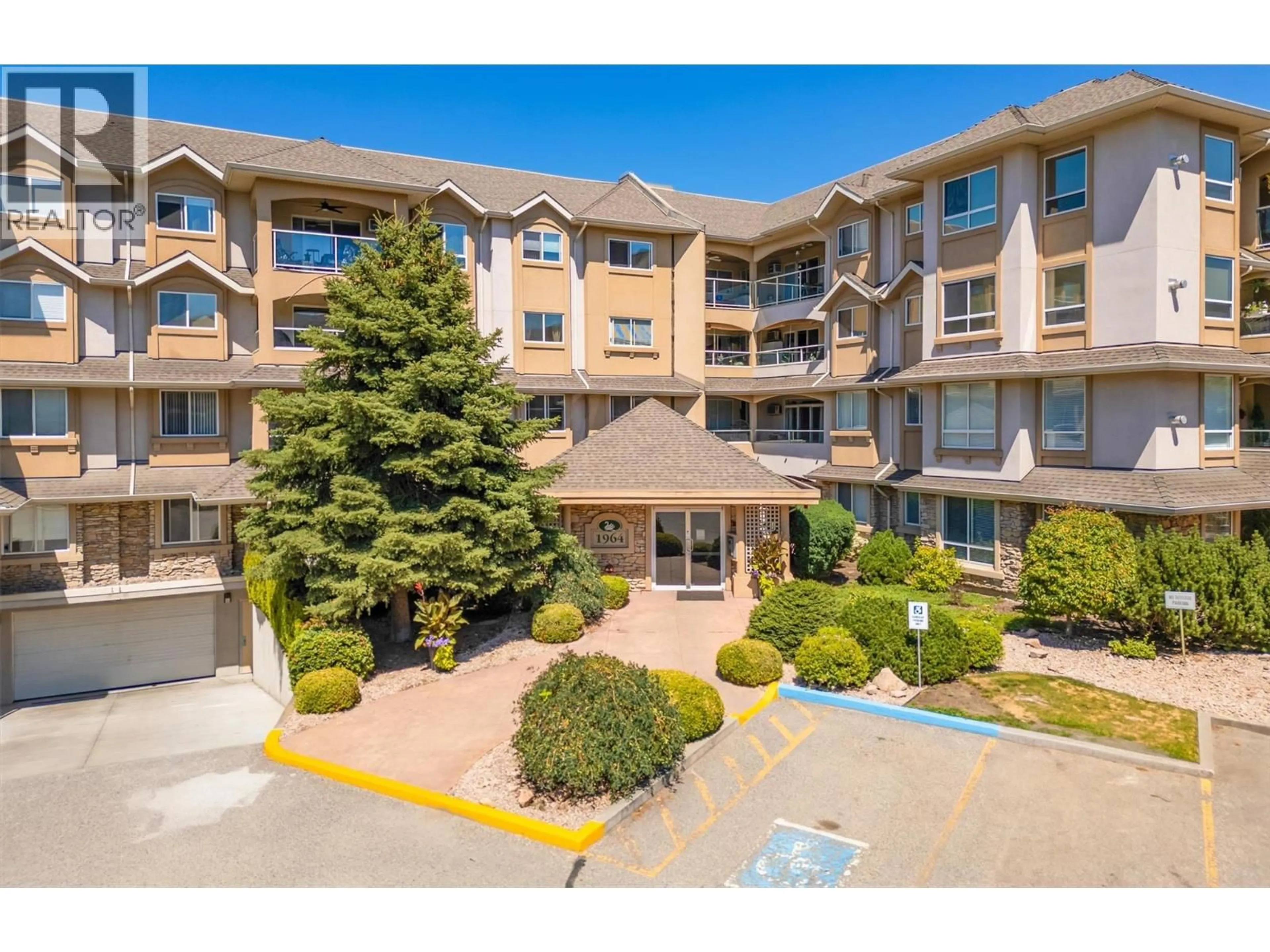 A pic from outside/outdoor area/front of a property/back of a property/a pic from drone, unknown for 309 - 1964 ENTERPRISE WAY, Kelowna British Columbia V1Y9S7