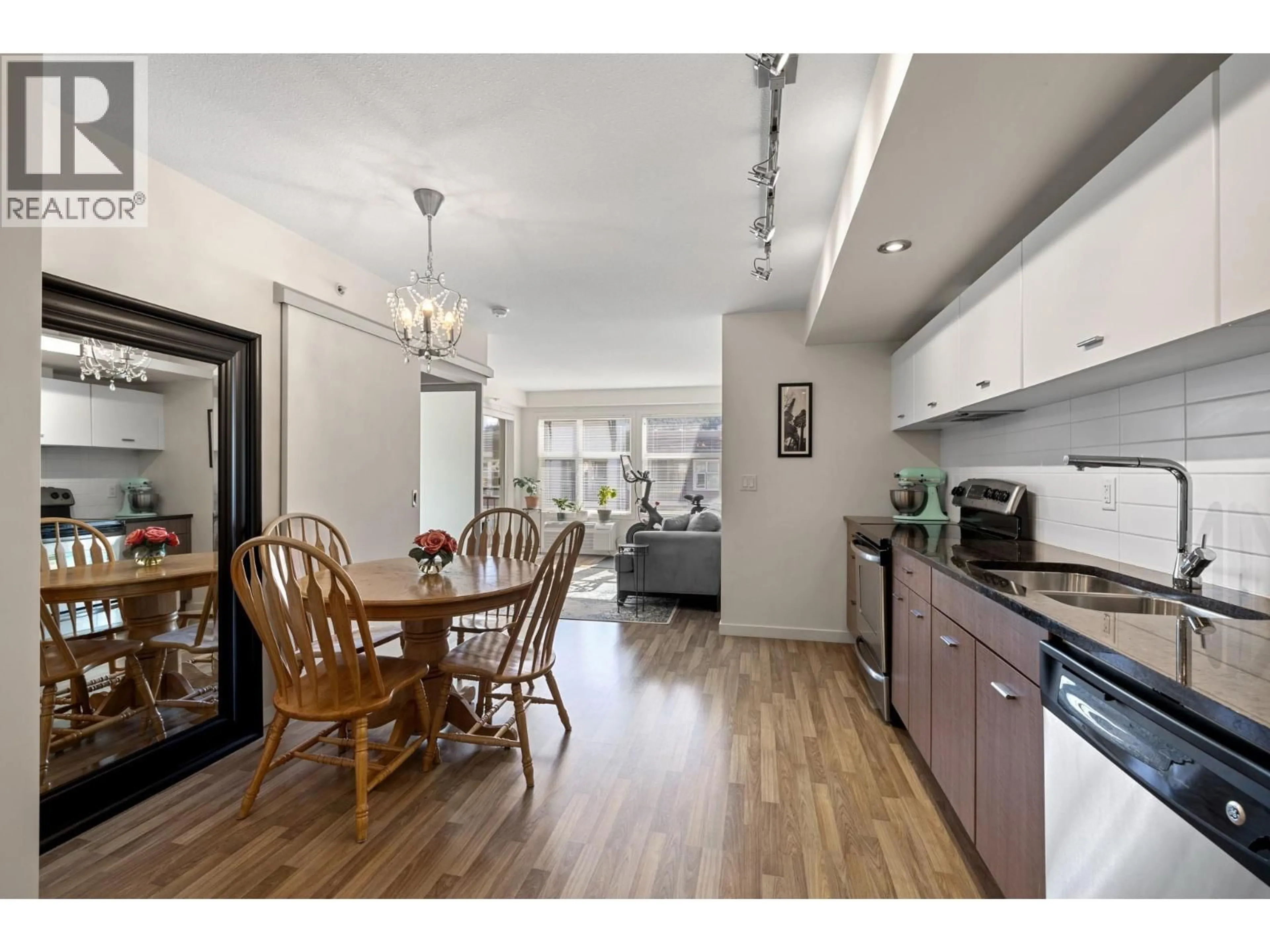 Open concept kitchen, wood/laminate floor for 406 - 547 YATES ROAD, Kelowna British Columbia V1V2T9