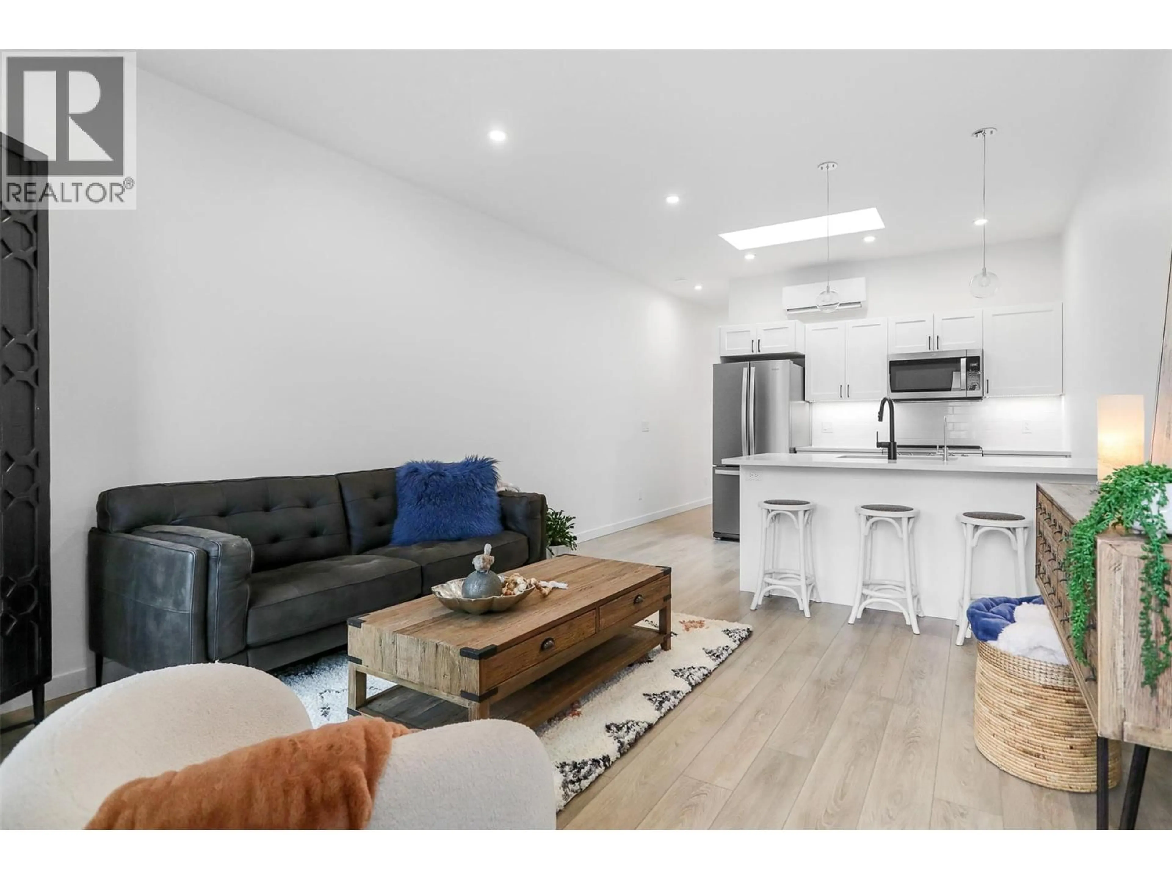 Open concept kitchen, wood/laminate floor for 219C - 8900 JIM BAILEY ROAD, Kelowna British Columbia V4V1E5