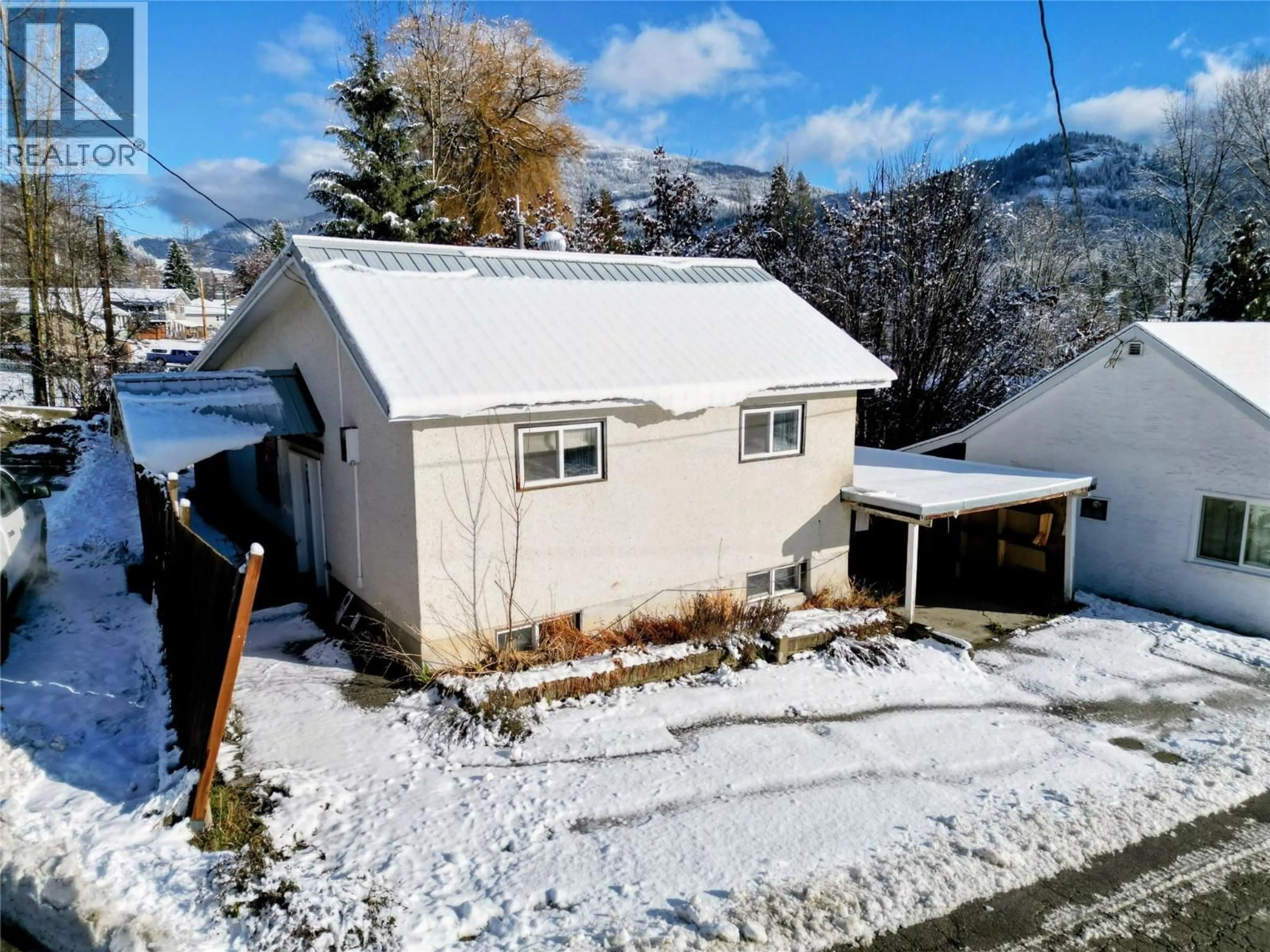 A pic from outside/outdoor area/front of a property/back of a property/a pic from drone, mountain view for 1866 COLE STREET, Fruitvale British Columbia V0G1L0