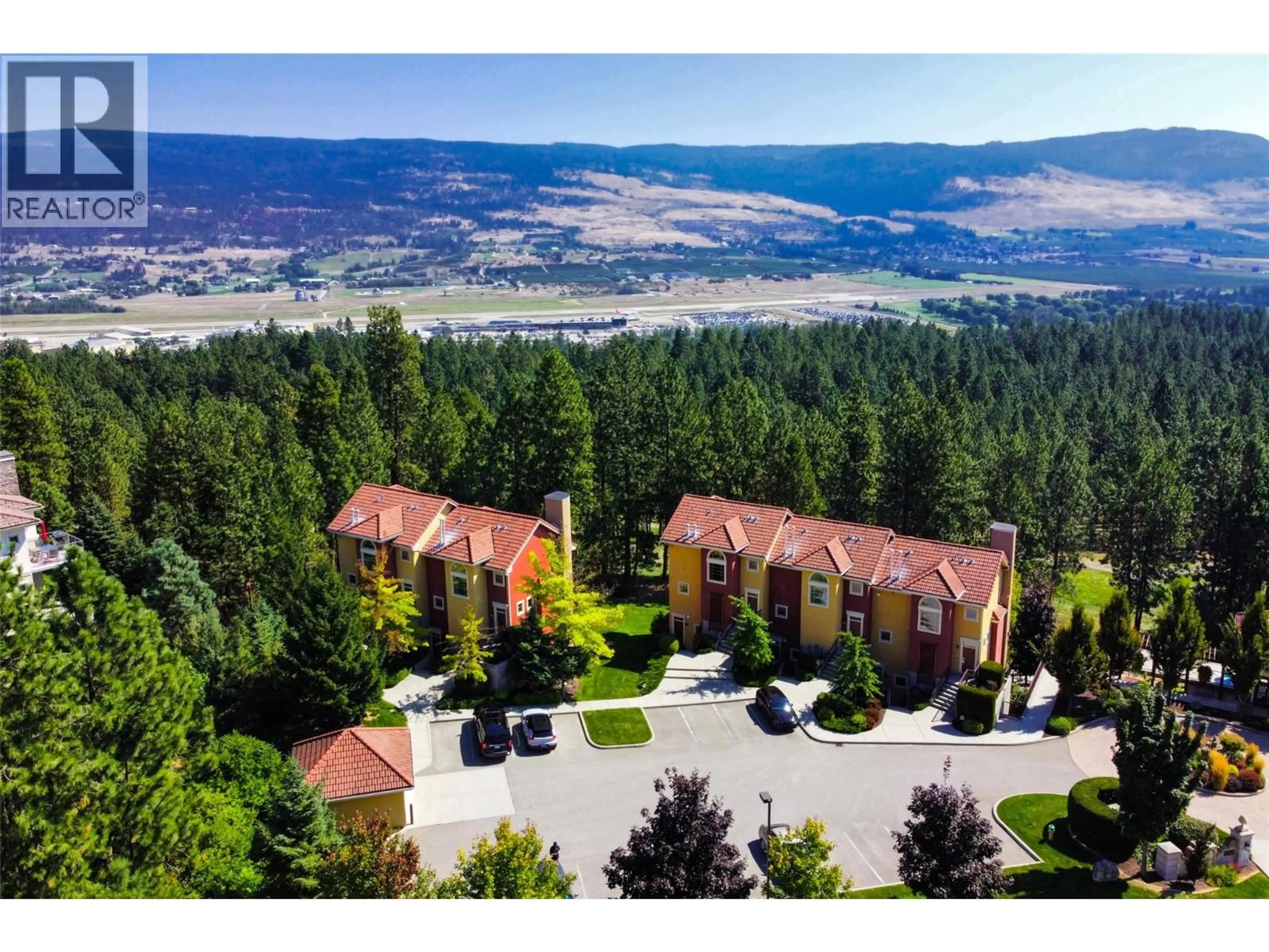 A pic from outside/outdoor area/front of a property/back of a property/a pic from drone, mountain view for 105 - 1795 COUNTRY CLUB DRIVE, Kelowna British Columbia V1V2V9