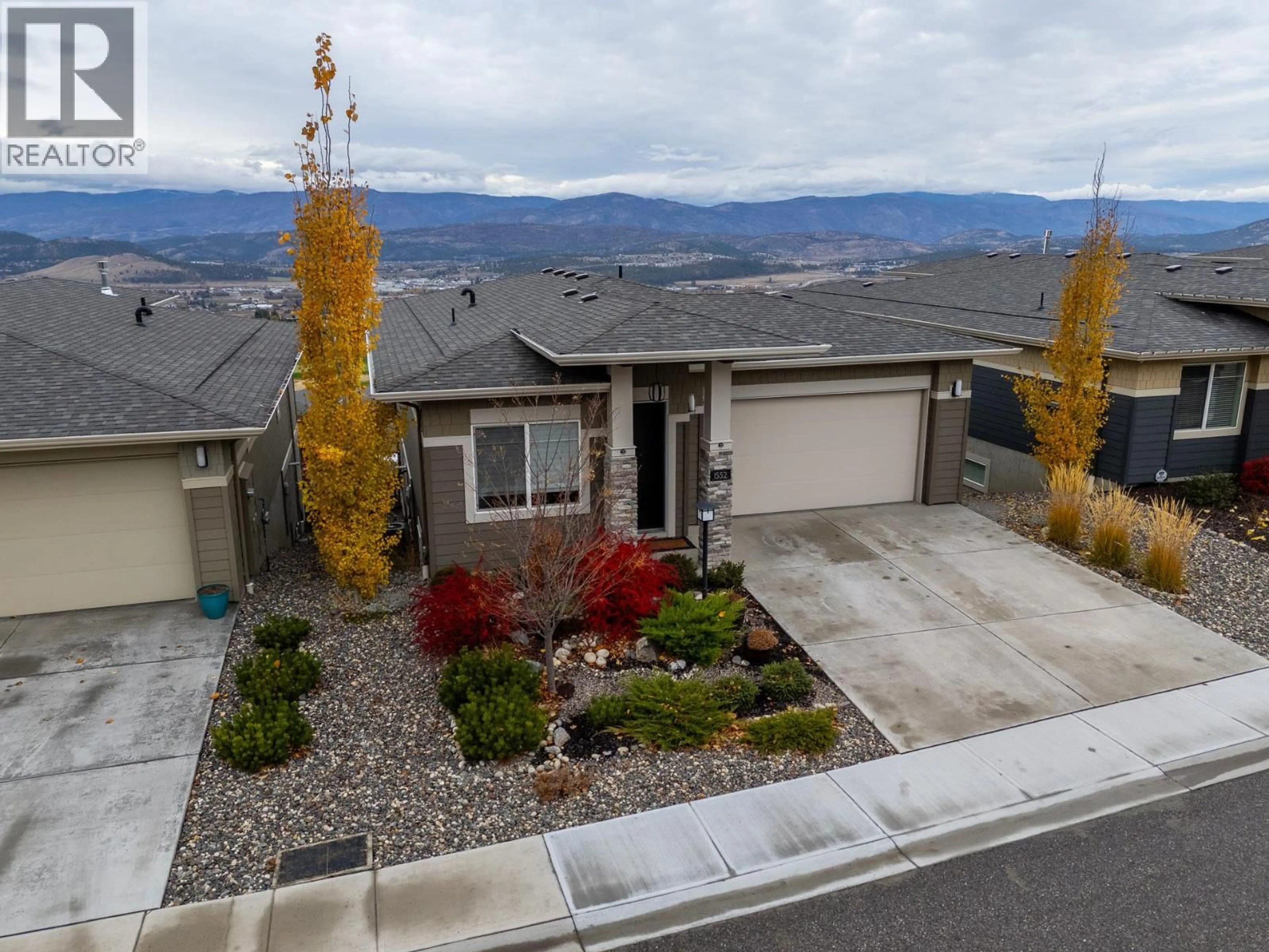 A pic from outside/outdoor area/front of a property/back of a property/a pic from drone, mountain view for 1552 SUMMER CRESCENT, Kelowna British Columbia V1P1T8