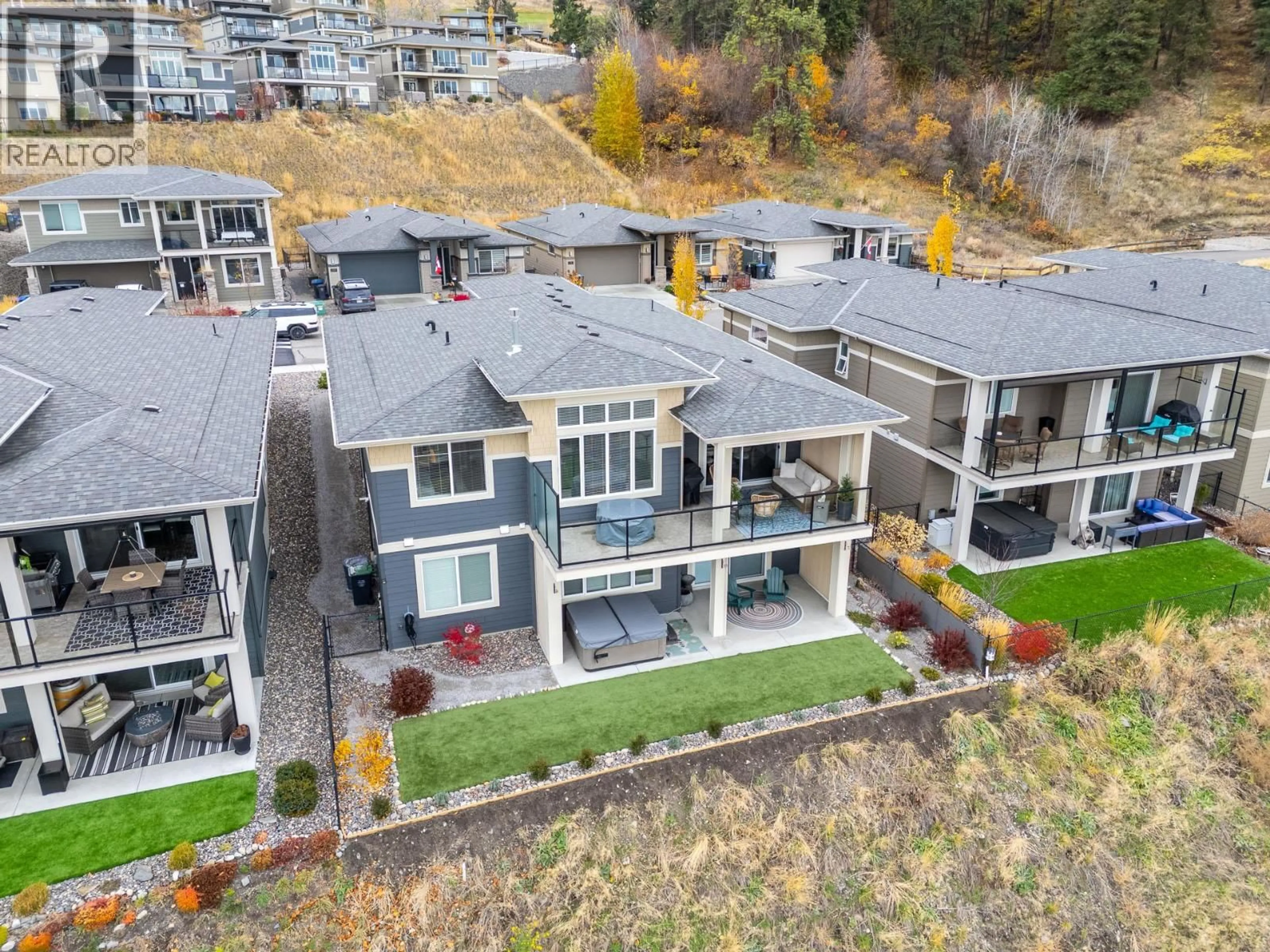 A pic from outside/outdoor area/front of a property/back of a property/a pic from drone, mountain view for 1552 SUMMER CRESCENT, Kelowna British Columbia V1P1T8