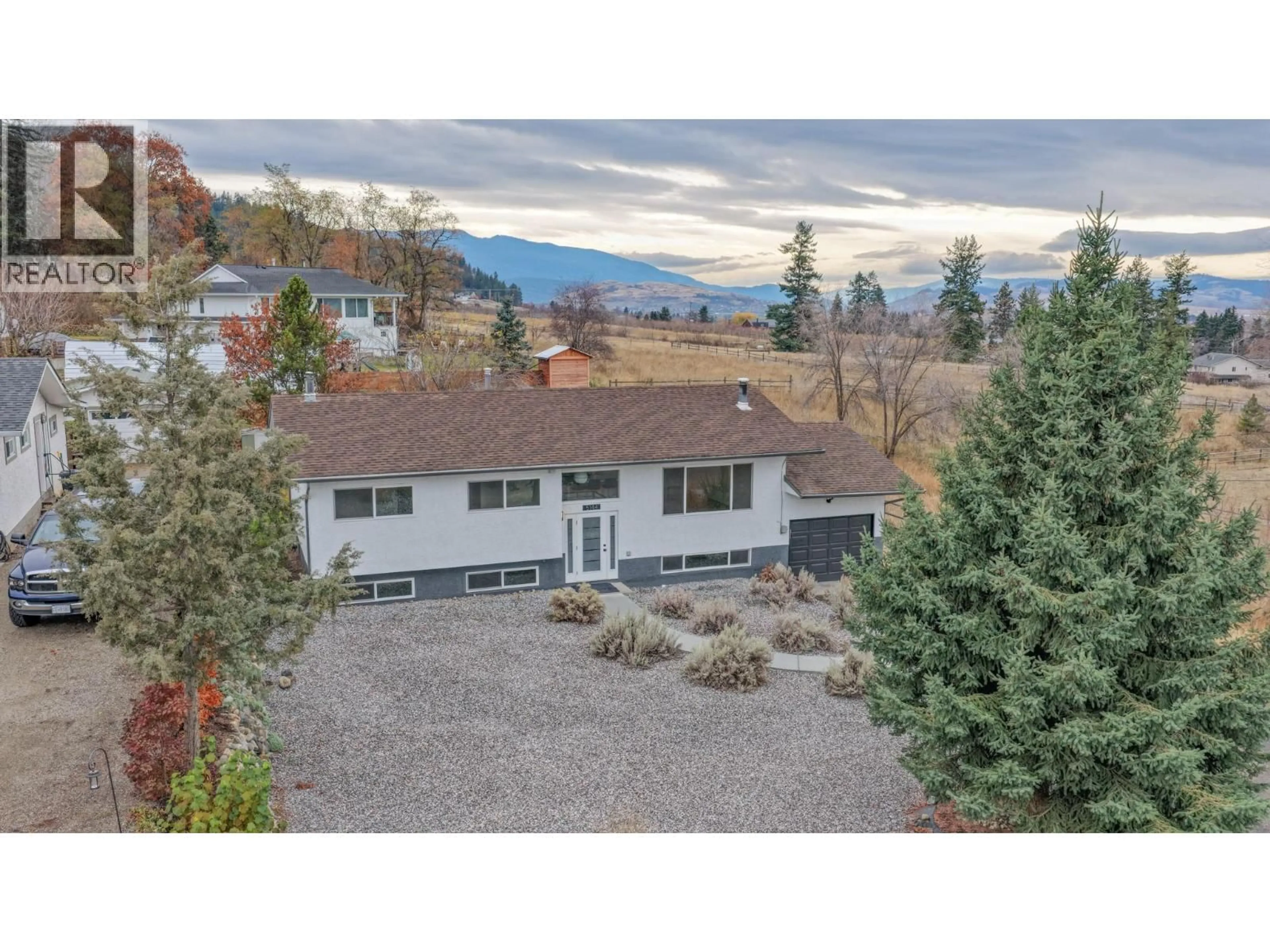 A pic from outside/outdoor area/front of a property/back of a property/a pic from drone, mountain view for 5144 HAYNES ROAD, Vernon British Columbia V1B3J6