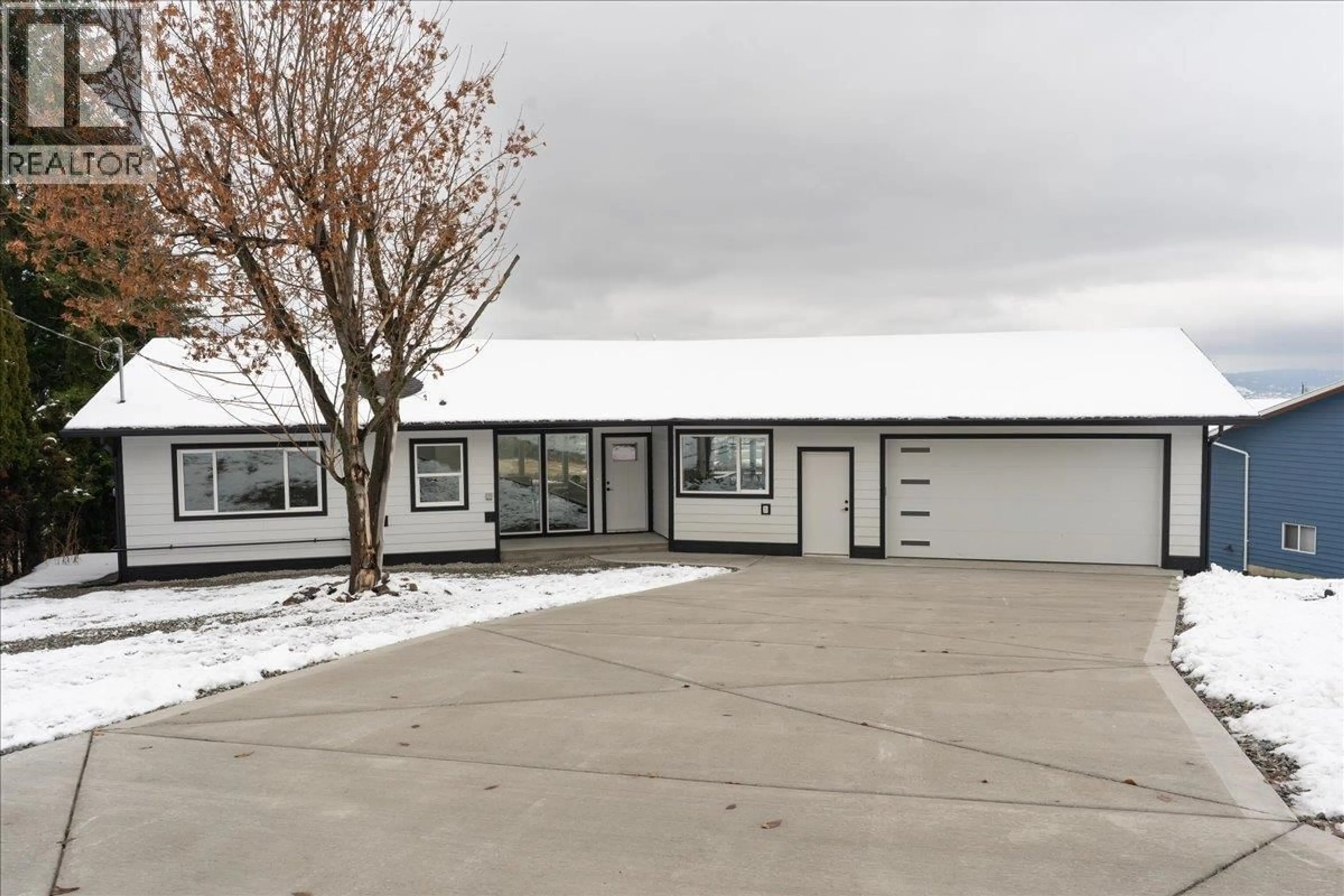 Home with vinyl exterior material, street for 6535 BLUE JAY ROAD, Vernon British Columbia V1H1W4