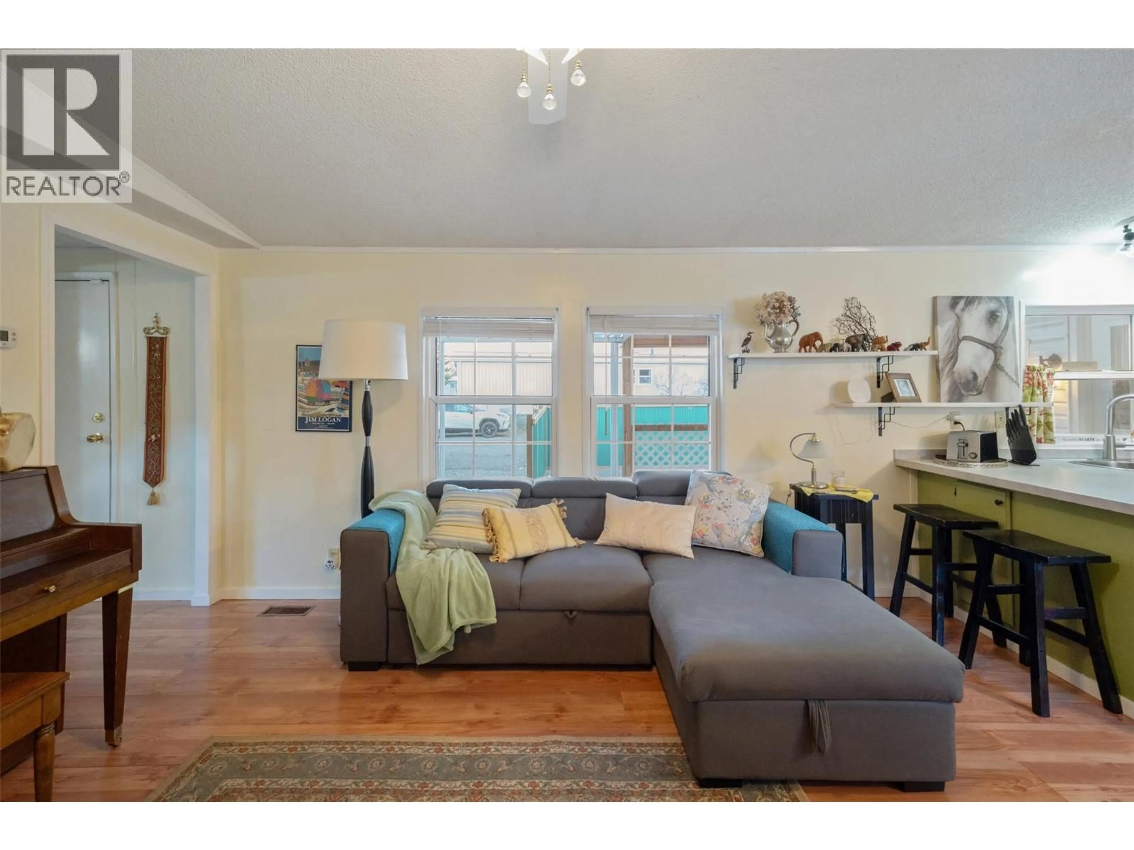 Living room with furniture, wood/laminate floor for 125 - 914 BLAKEBOROUGH AVENUE, Keremeos British Columbia V0X1N2