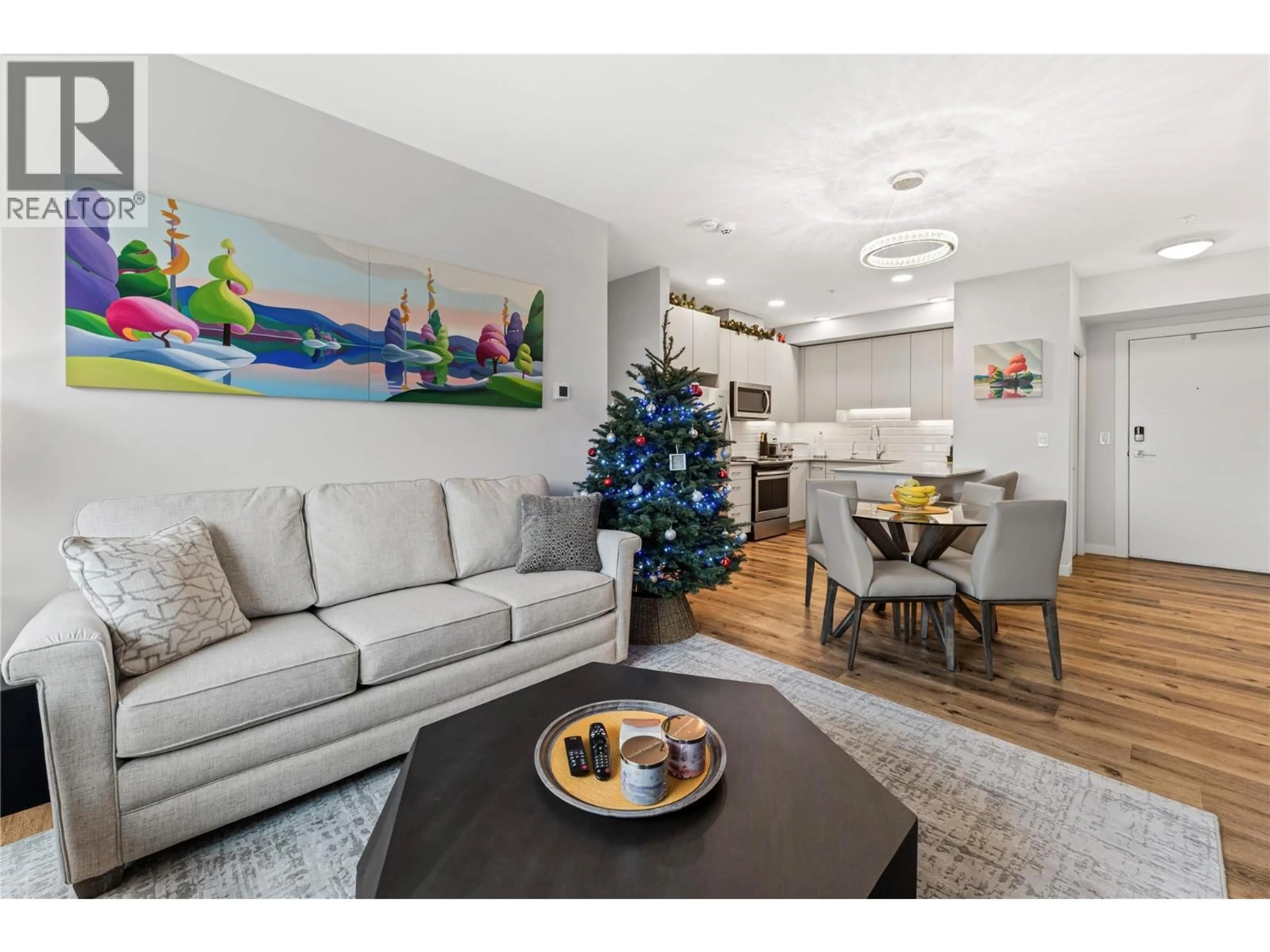 Living room with furniture, wood/laminate floor for 300 - 722 VALLEY ROAD, Kelowna British Columbia V1V0E2