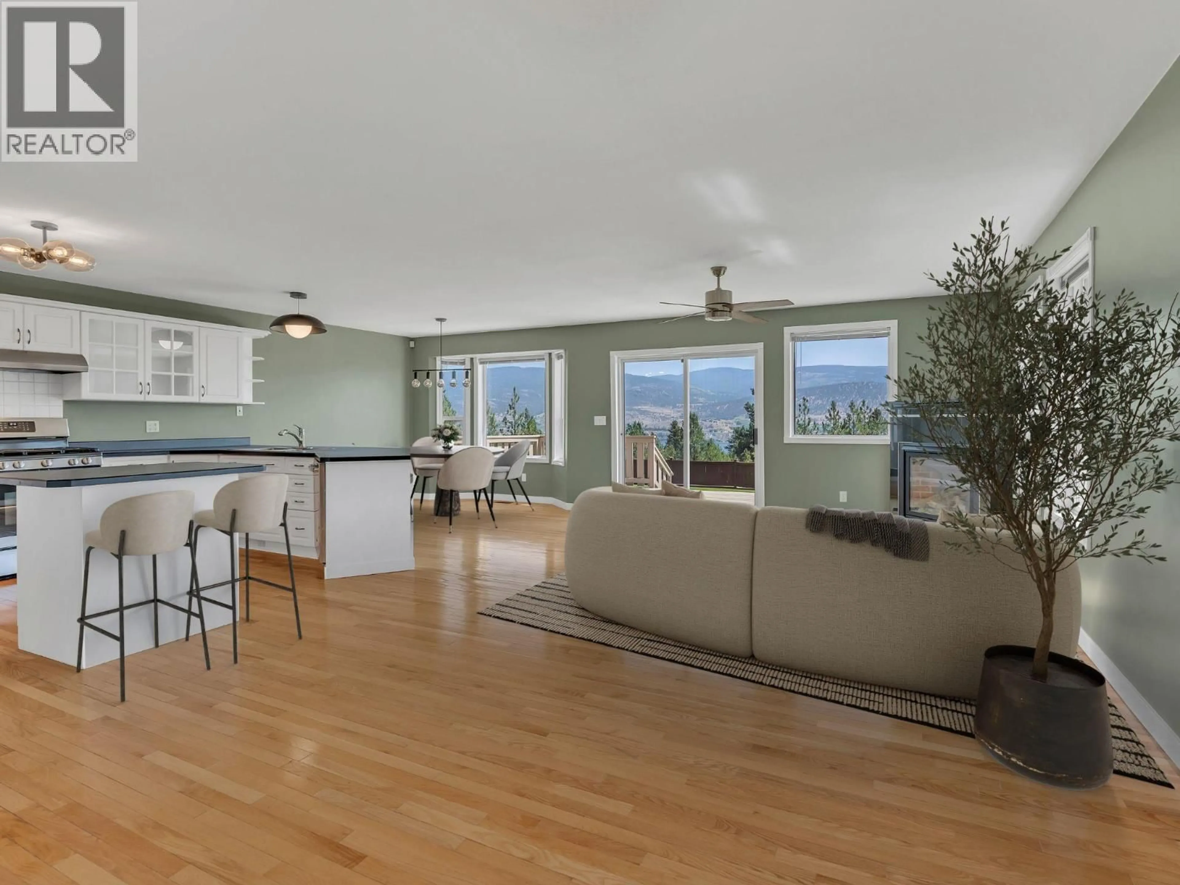 Open concept kitchen, wood/laminate floor for 1893 SANDSTONE DRIVE, Penticton British Columbia V2A8Y6