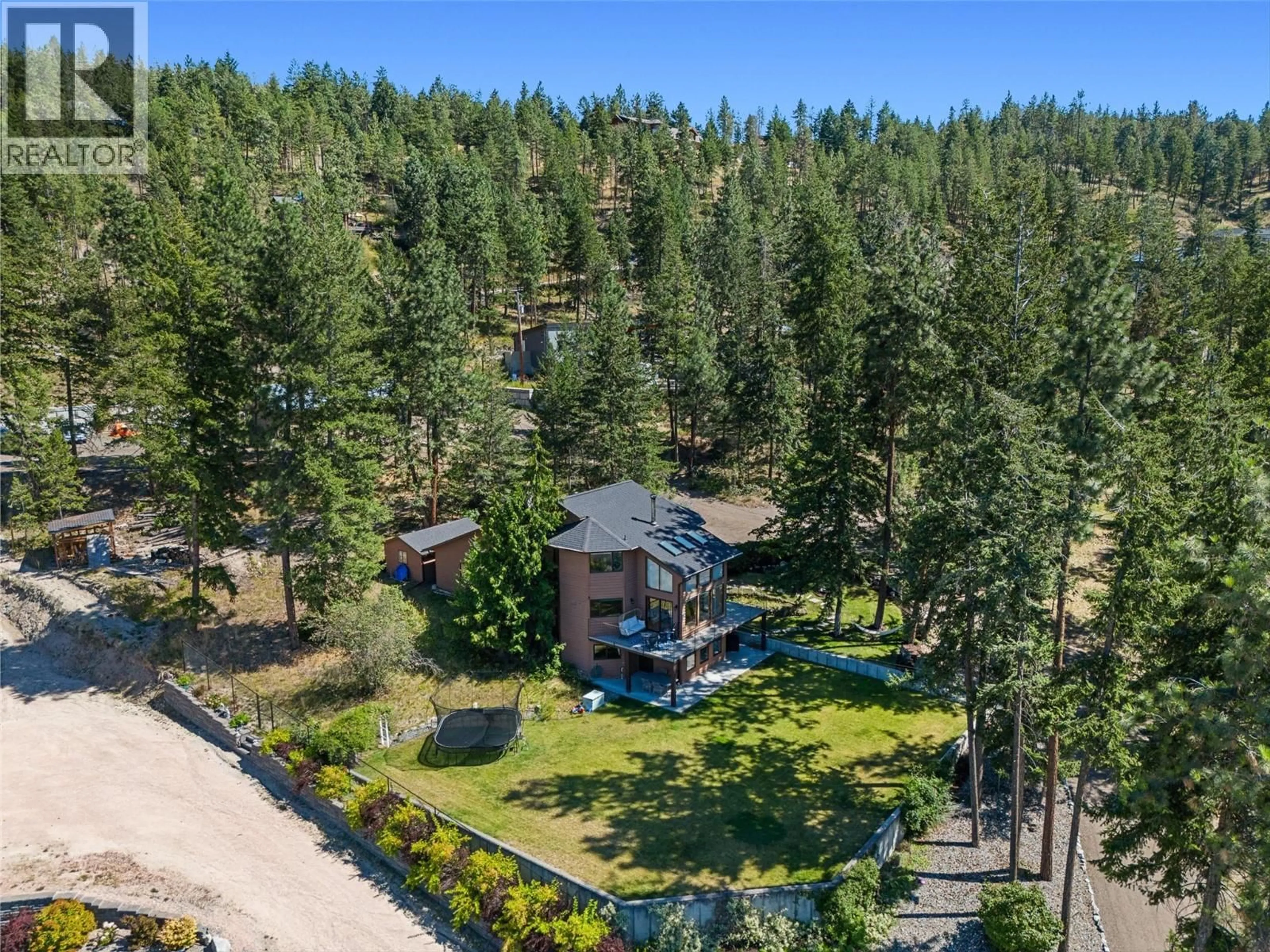 A pic from outside/outdoor area/front of a property/back of a property/a pic from drone, forest/trees view for 4555 OTTLEY ROAD, Lake Country British Columbia V4K1N1