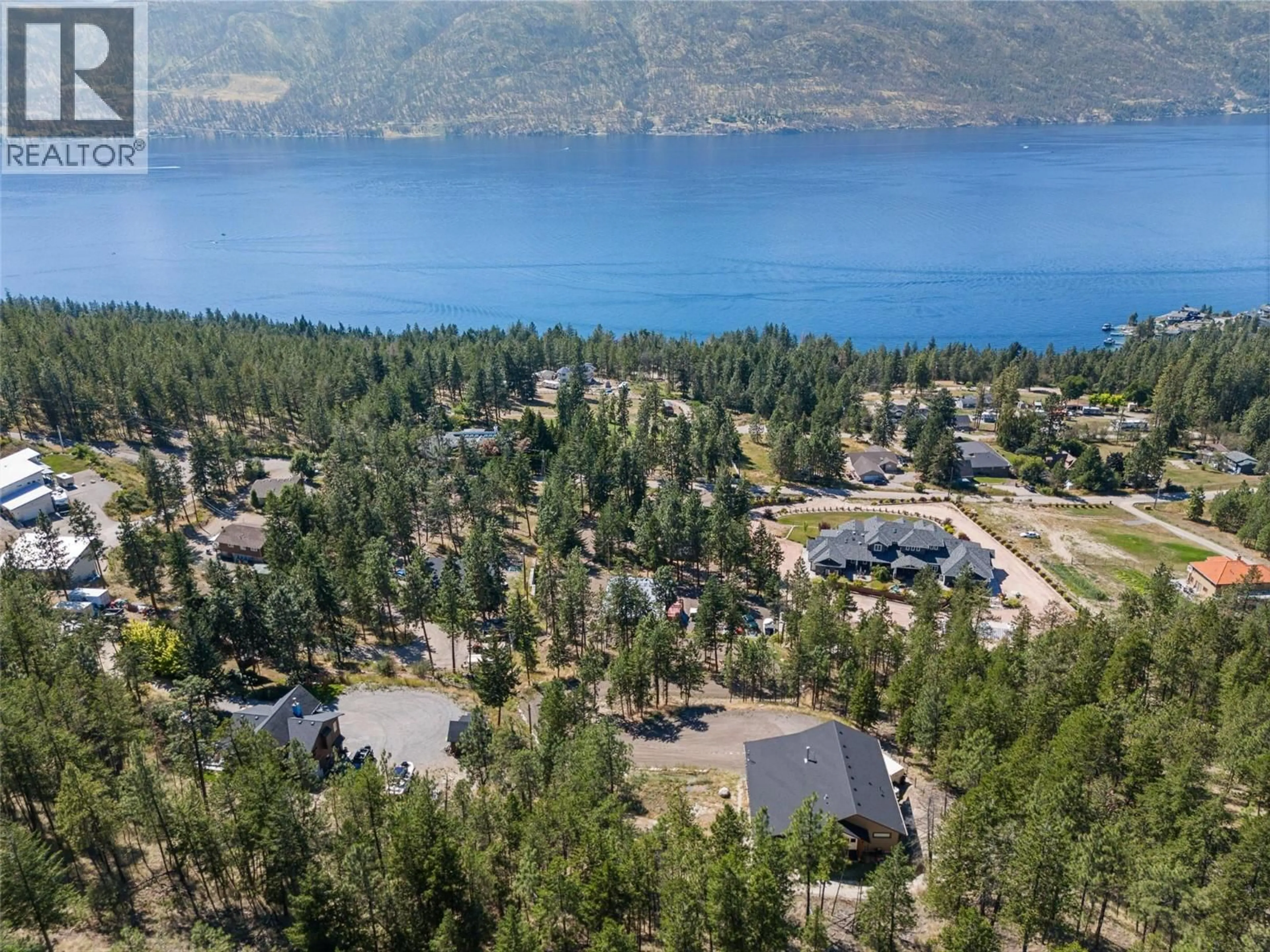 A pic from outside/outdoor area/front of a property/back of a property/a pic from drone, mountain view for 4555 OTTLEY ROAD, Lake Country British Columbia V4K1N1