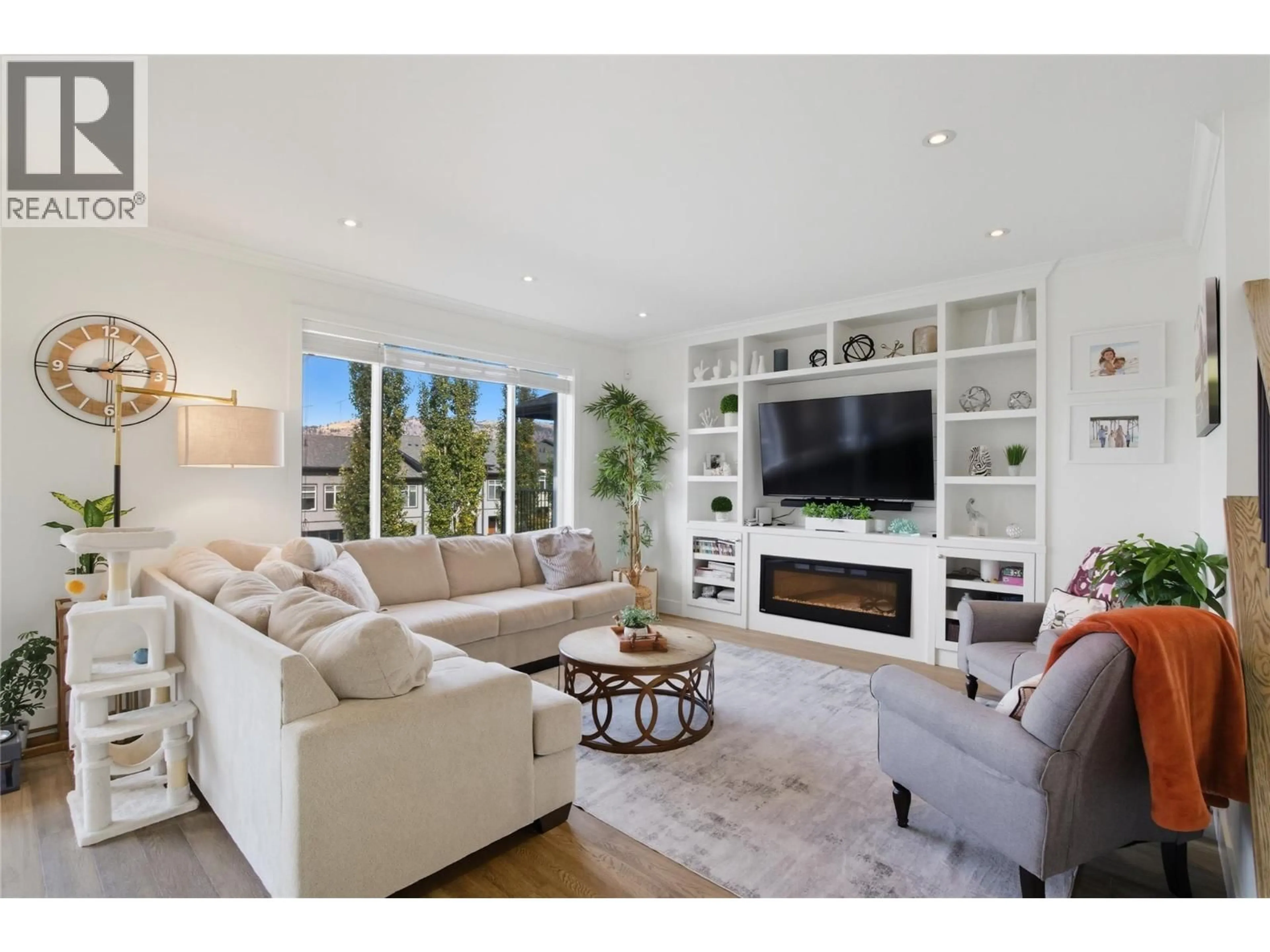 Living room with furniture, wood/laminate floor for 1553 EMERALD DRIVE, Kamloops British Columbia V2E0C4