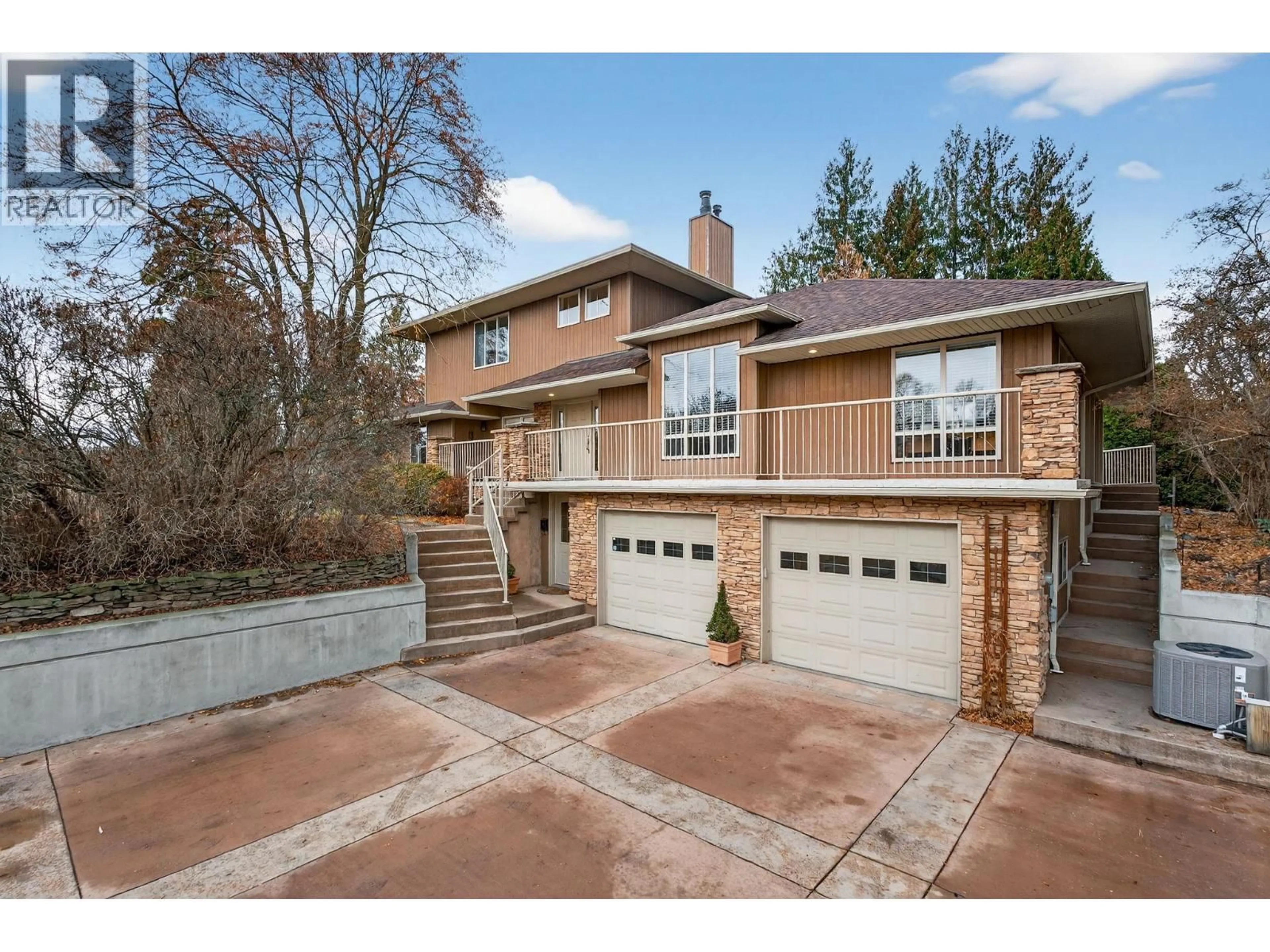 Home with brick exterior material, street for 1774 HIGHLAND DRIVE NORTH, Kelowna British Columbia V1Y4L2