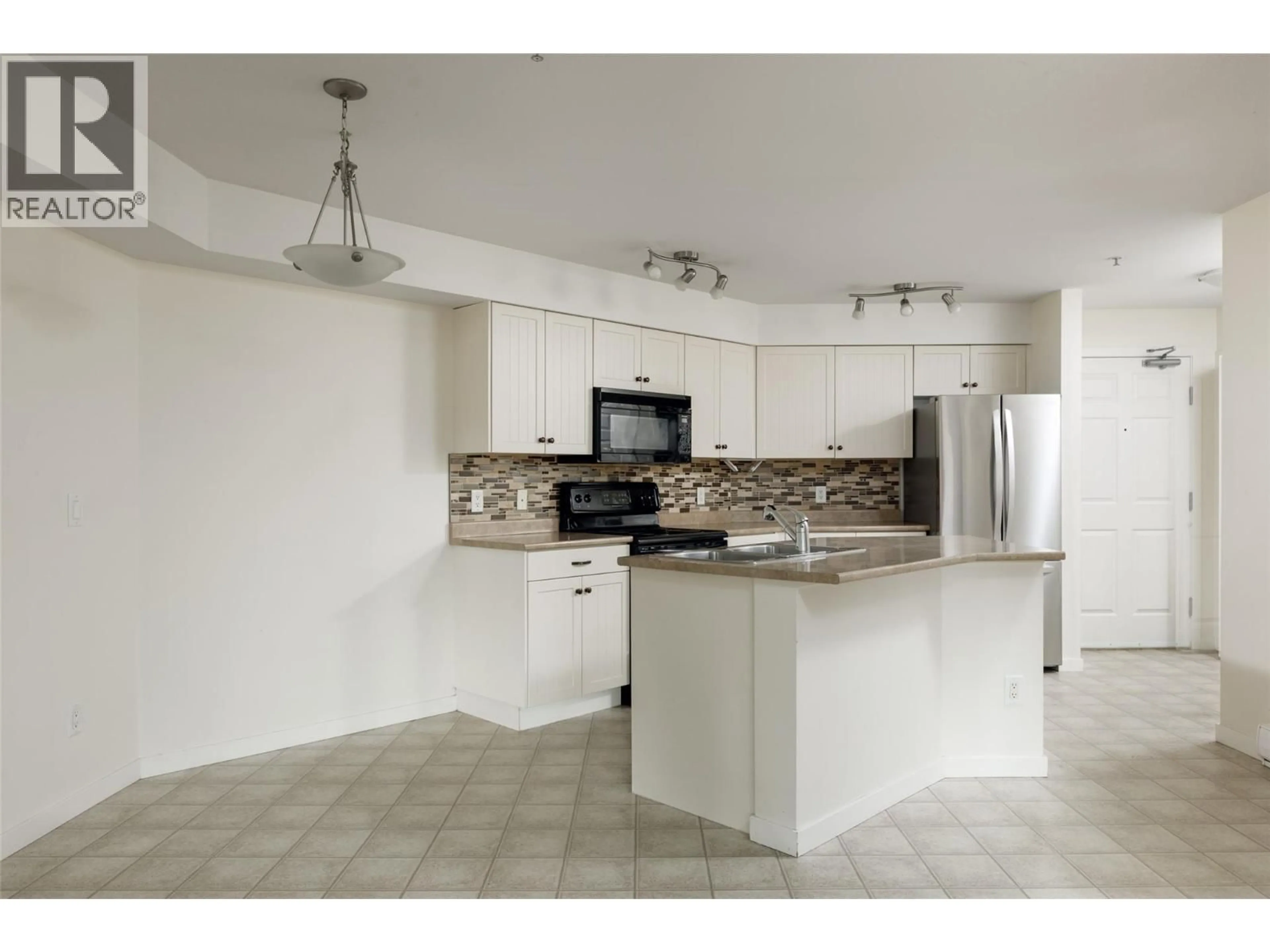Standard kitchen, ceramic/tile floor for 111 - 135 ZIPRICK ROAD, Kelowna British Columbia V1X8B2
