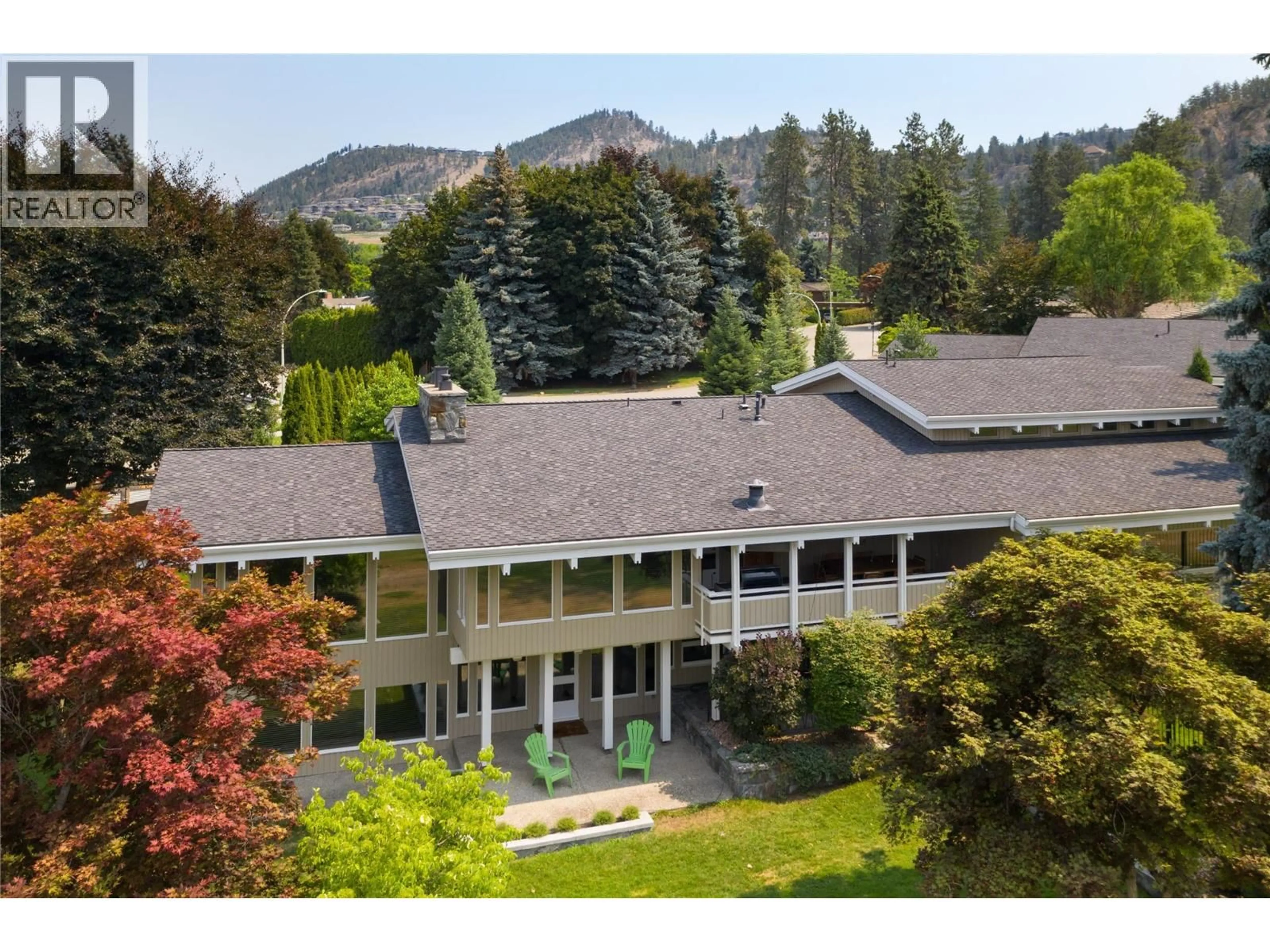 A pic from outside/outdoor area/front of a property/back of a property/a pic from drone, mountain view for 930 FAIRWAY CRESCENT, Kelowna British Columbia V1Y4S7