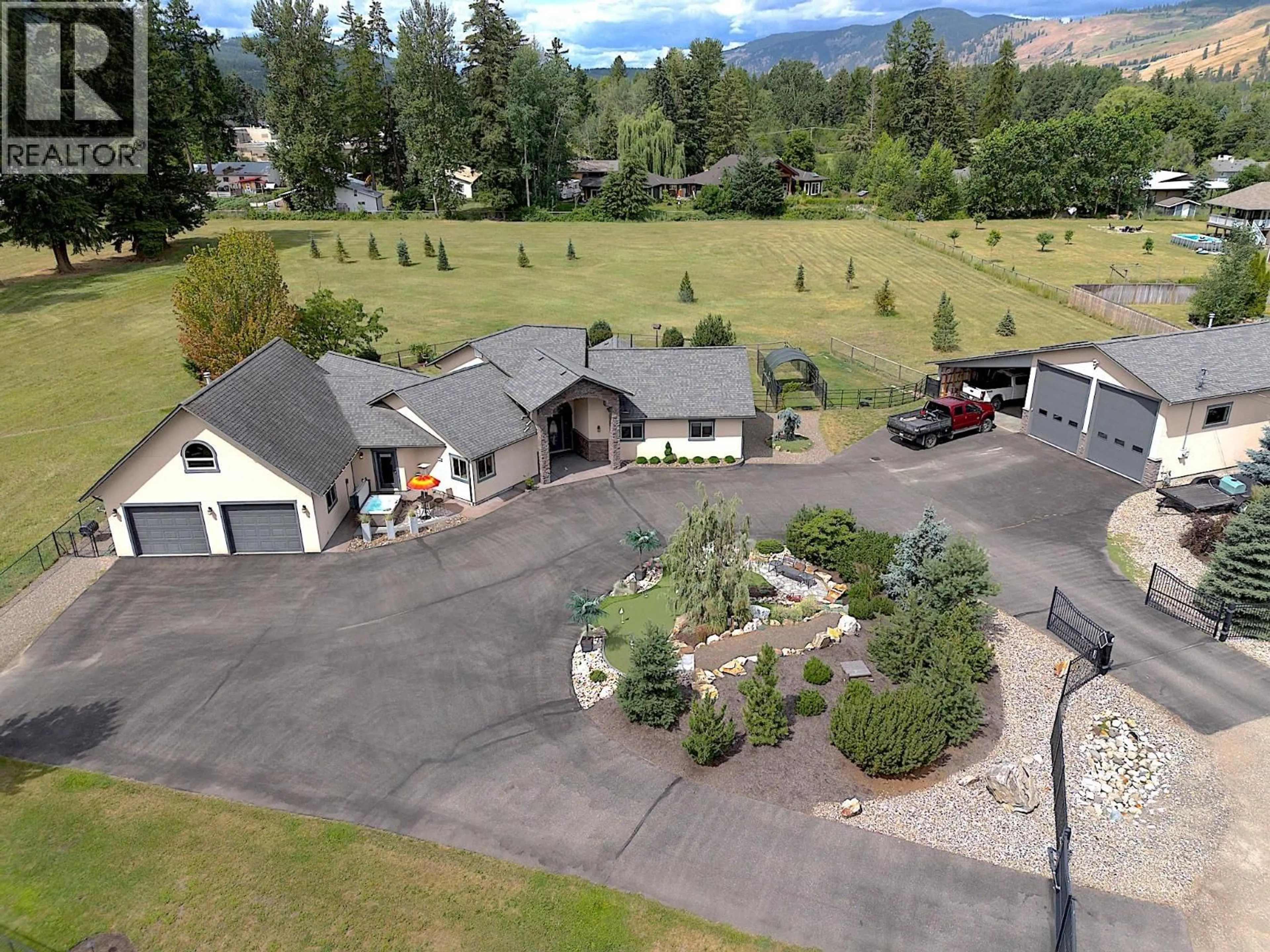 A pic from outside/outdoor area/front of a property/back of a property/a pic from drone, mountain view for 384 KYRO ROAD, Lumby British Columbia V0E2G7