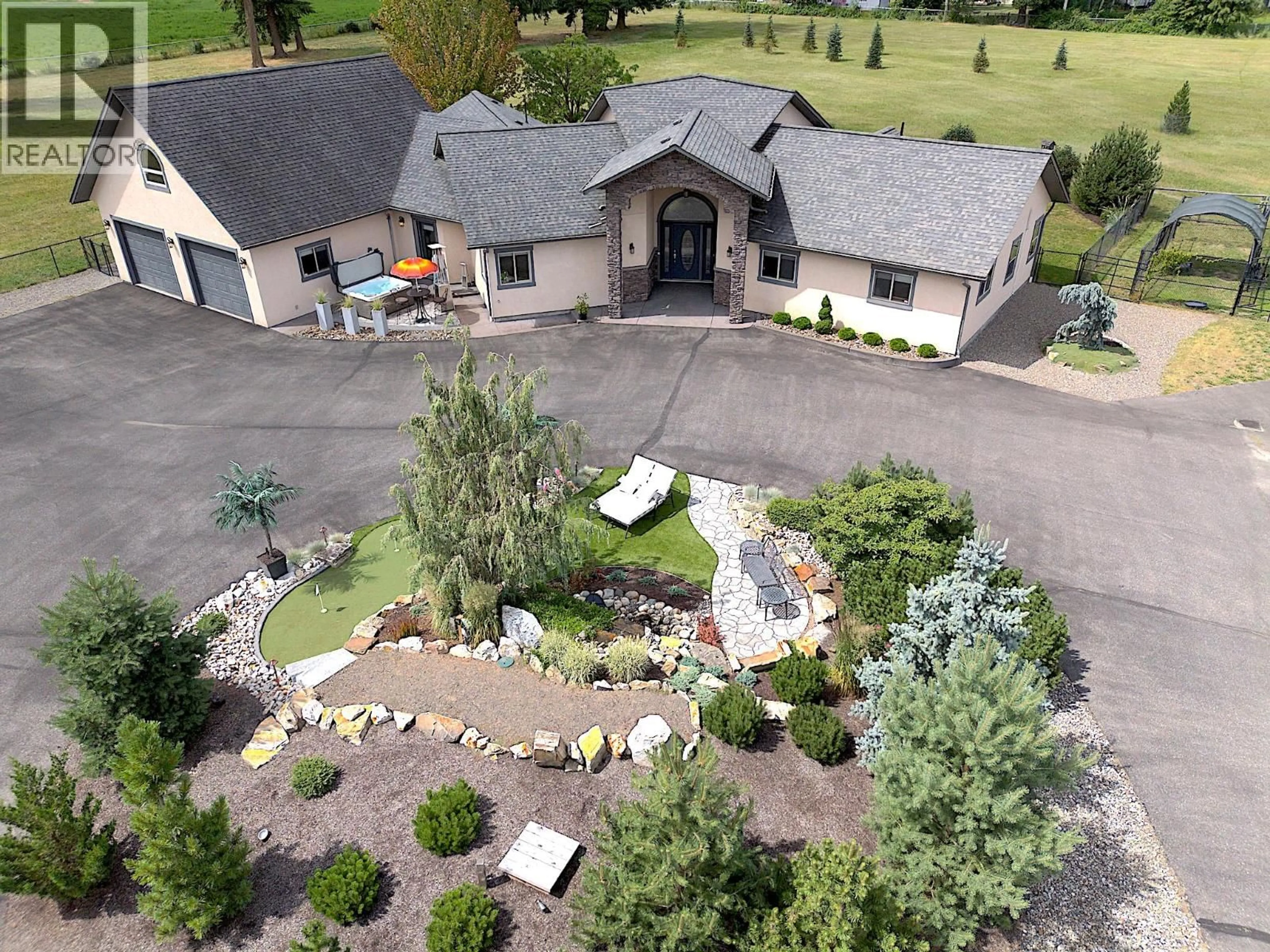 A pic from outside/outdoor area/front of a property/back of a property/a pic from drone, mountain view for 384 KYRO ROAD, Lumby British Columbia V0E2G7